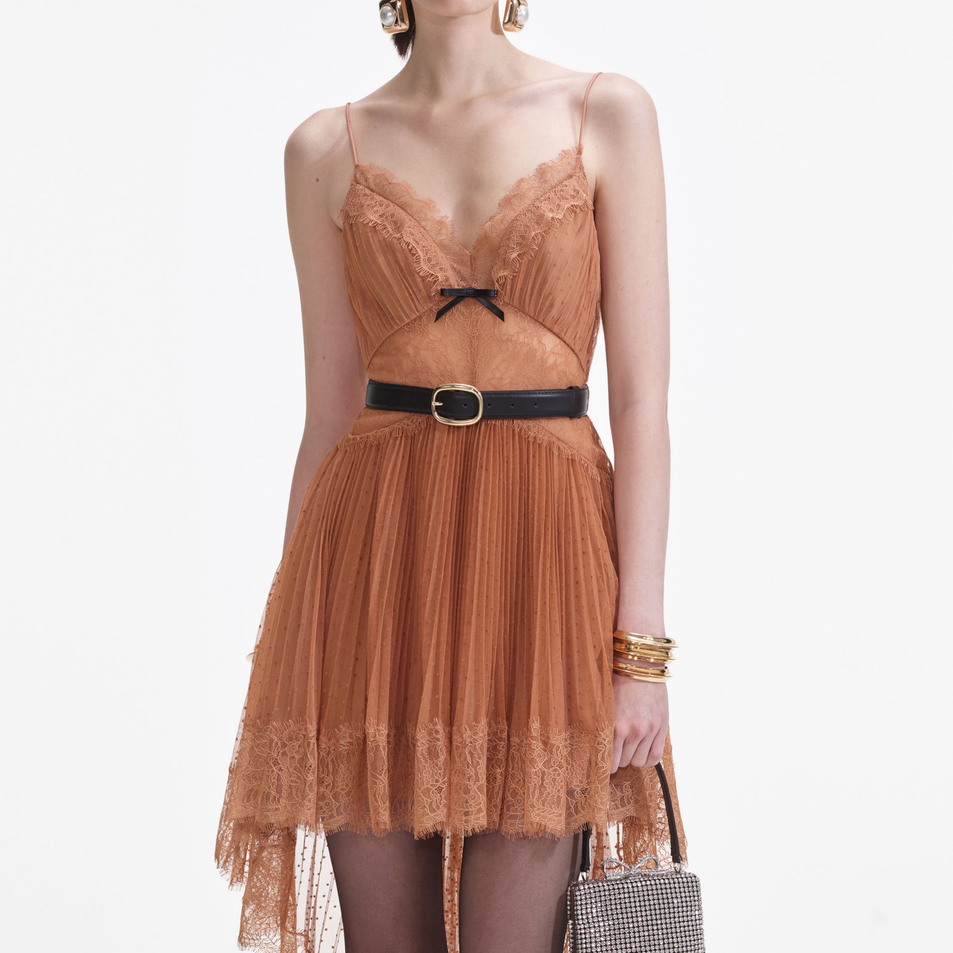 A close up of a woman wearing the Tan Dot Mesh Mini Dress