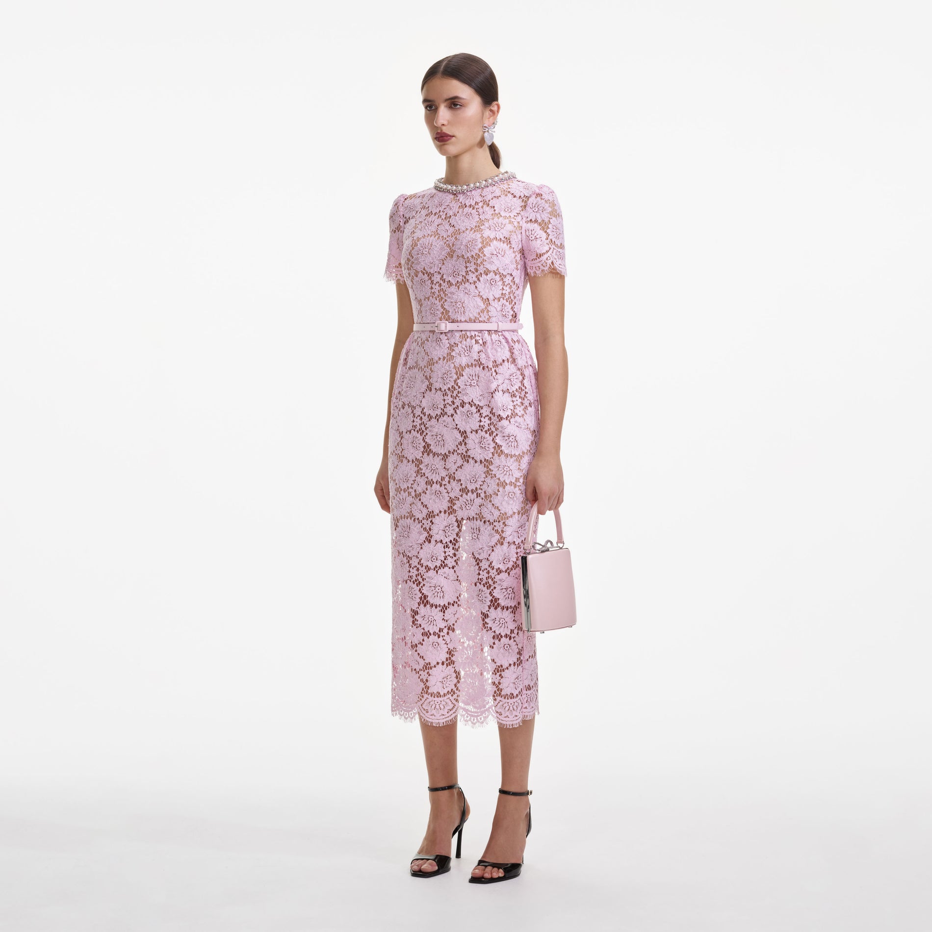Side view of a woman wearing the Pink Fine Lace Pearl Midi Dress