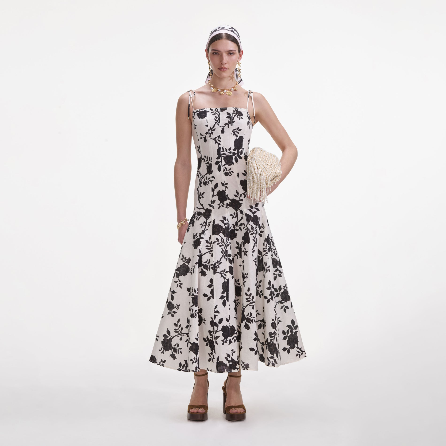 Front view of a woman wearing the Floral Print Linen Midi Dress