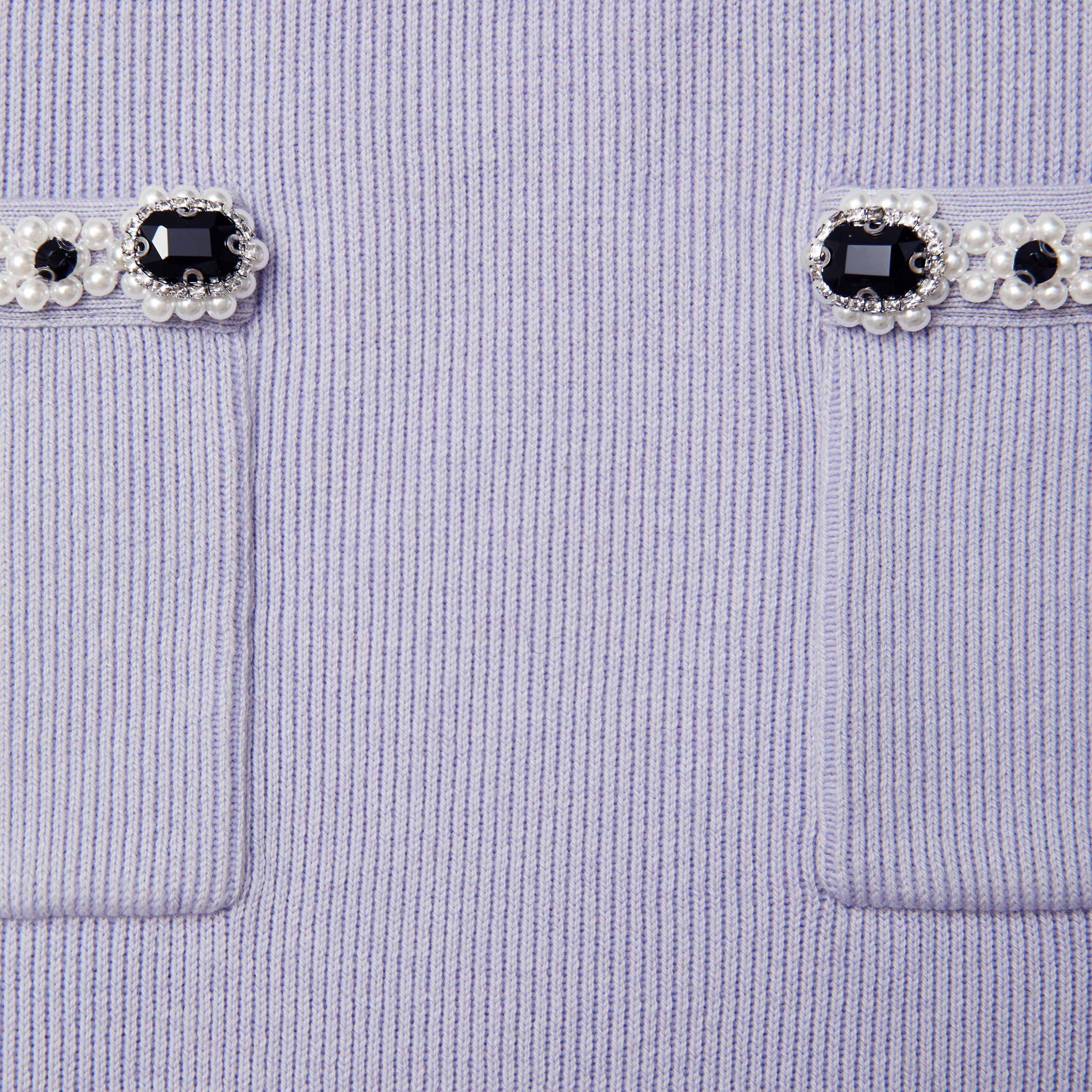 Side view of a woman wearing the Lilac Embellished Knit Midi Skirt