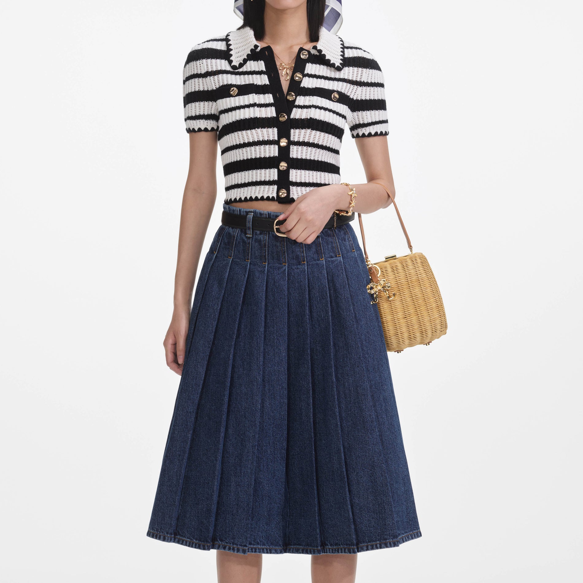 A close up of a woman wearing the Cream And Black Striped Crochet Top