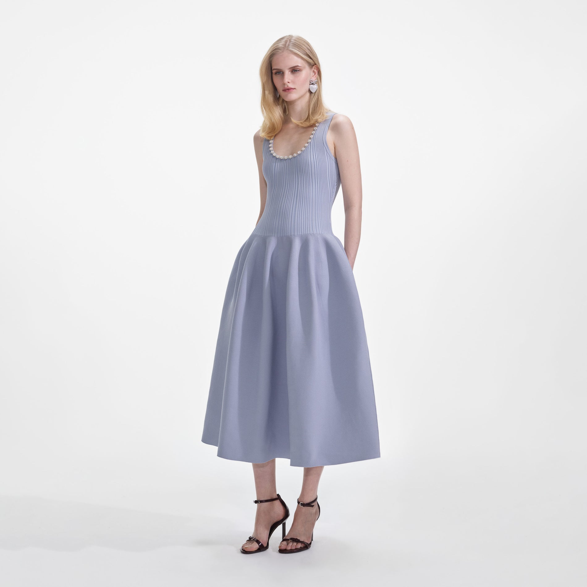 Side view of a woman wearing the Blue Ribbed Knit Diamante Midi Dress