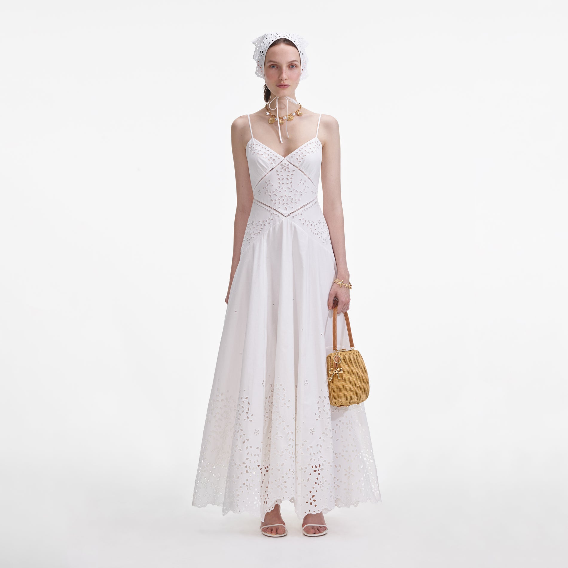 Front view of a woman wearing the White Cotton Embroidered Maxi Dress