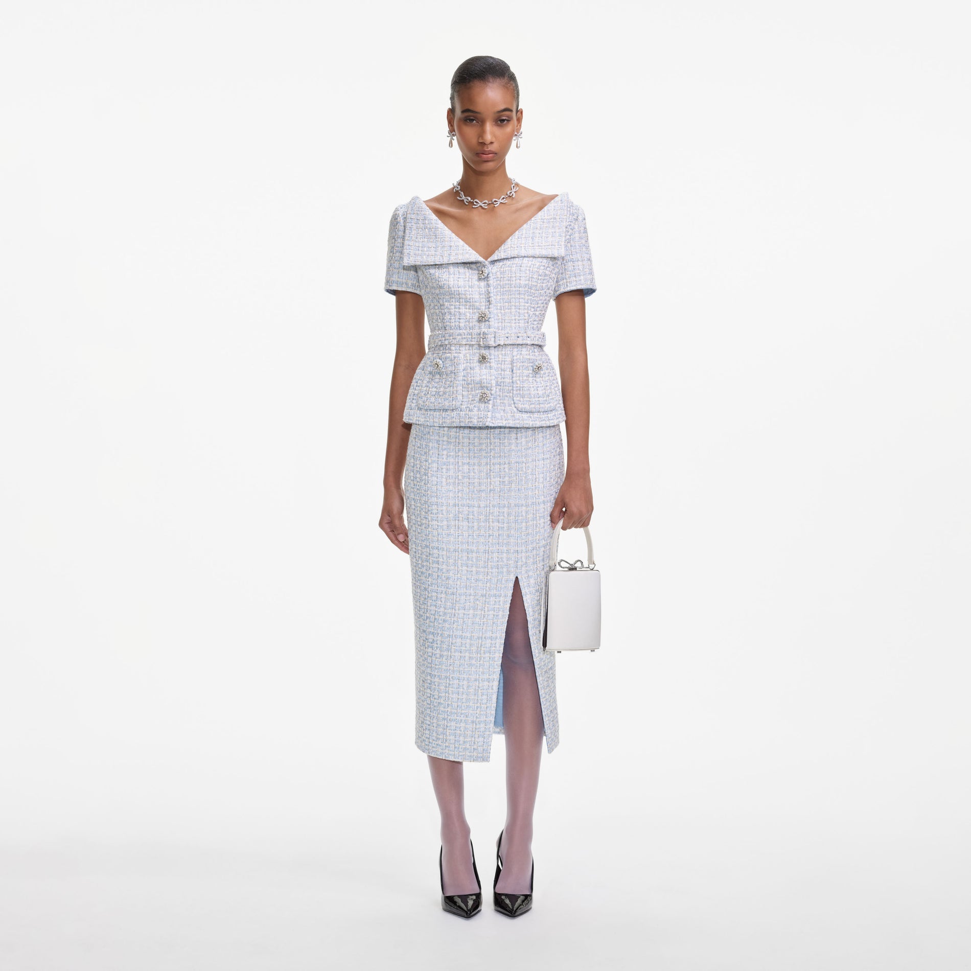 Front view of a woman wearing the Blue Boucle Midi Dress