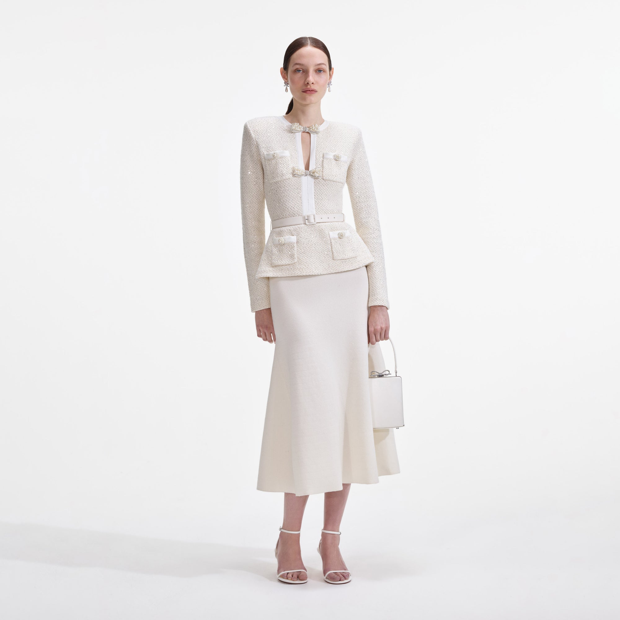 Front view of a woman wearing the Cream Sequin Knit Tailored Midi Dress