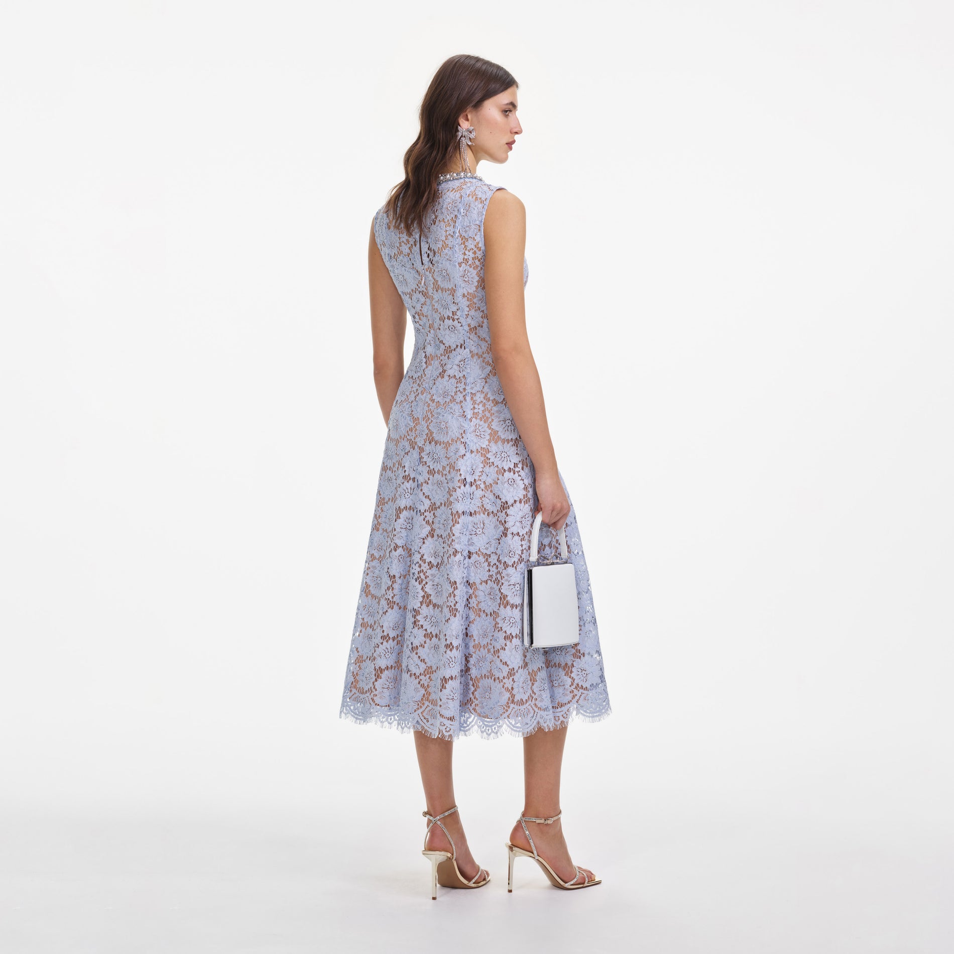 Back view of a woman wearing the Blue Fine Lace Pearl Midi Dress