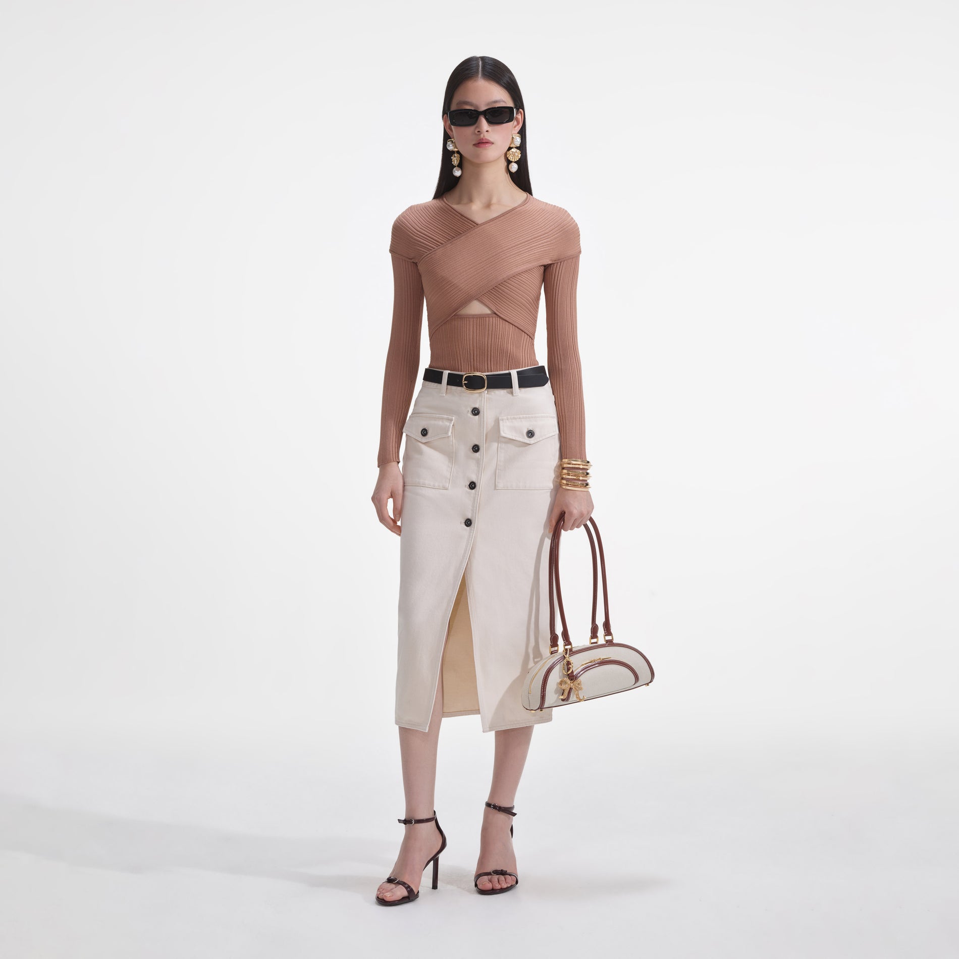 Front view of a woman wearing the Beige Ribbed Knit Wrap Top