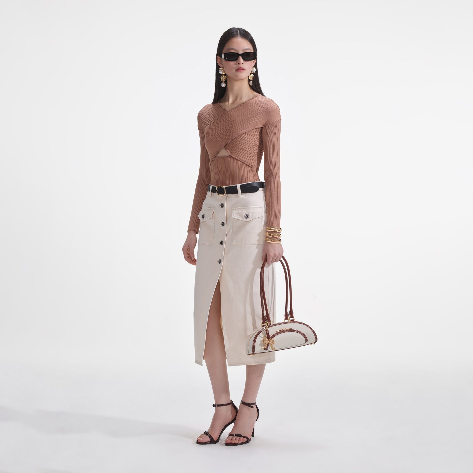 Side view of a woman wearing the Beige Ribbed Knit Wrap Top