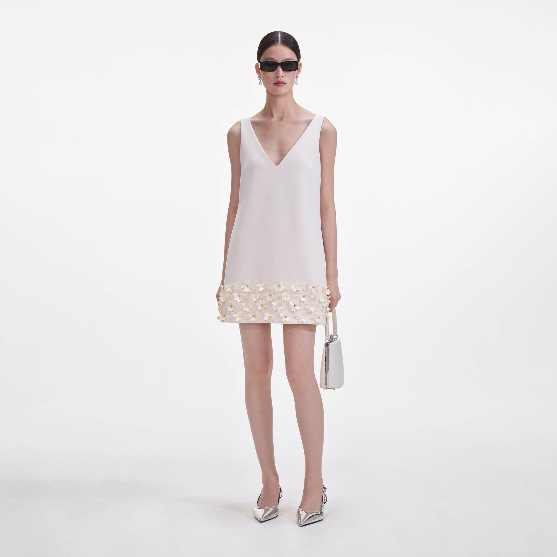 Front view of a woman wearing the Cream Crepe 3D Sequin Mini Dress