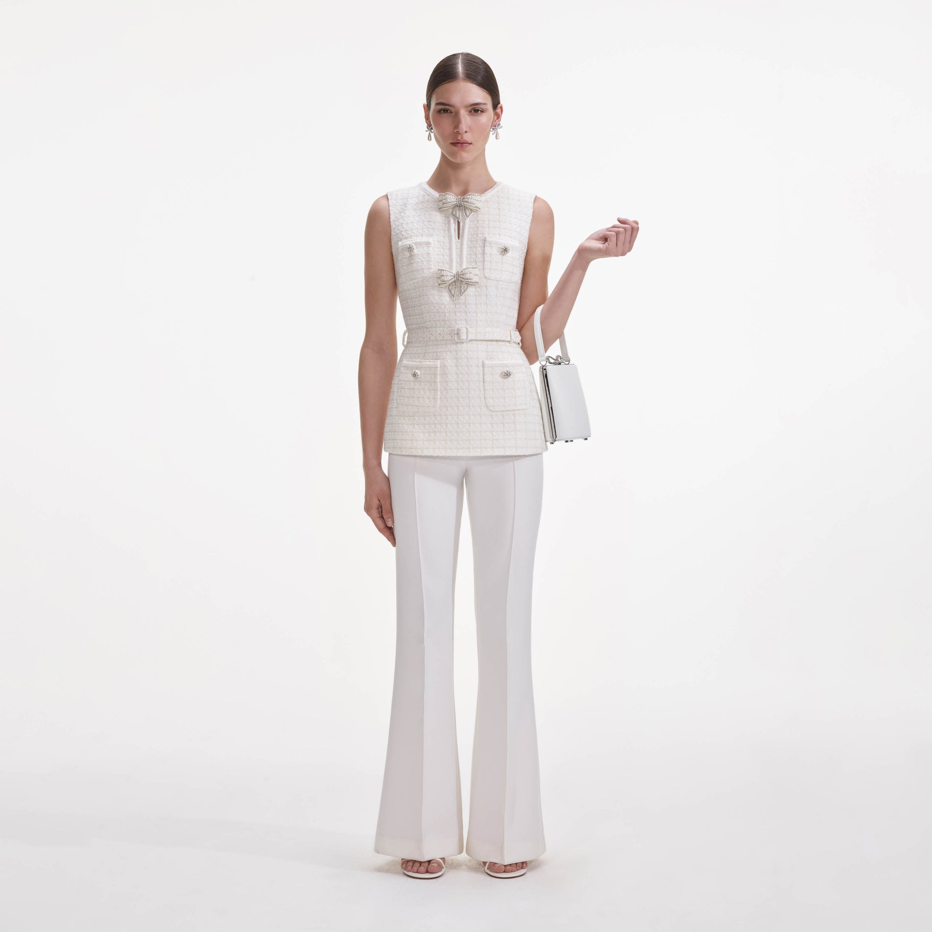 Front view of a woman wearing the Cream Boucle Bow Jumpsuit