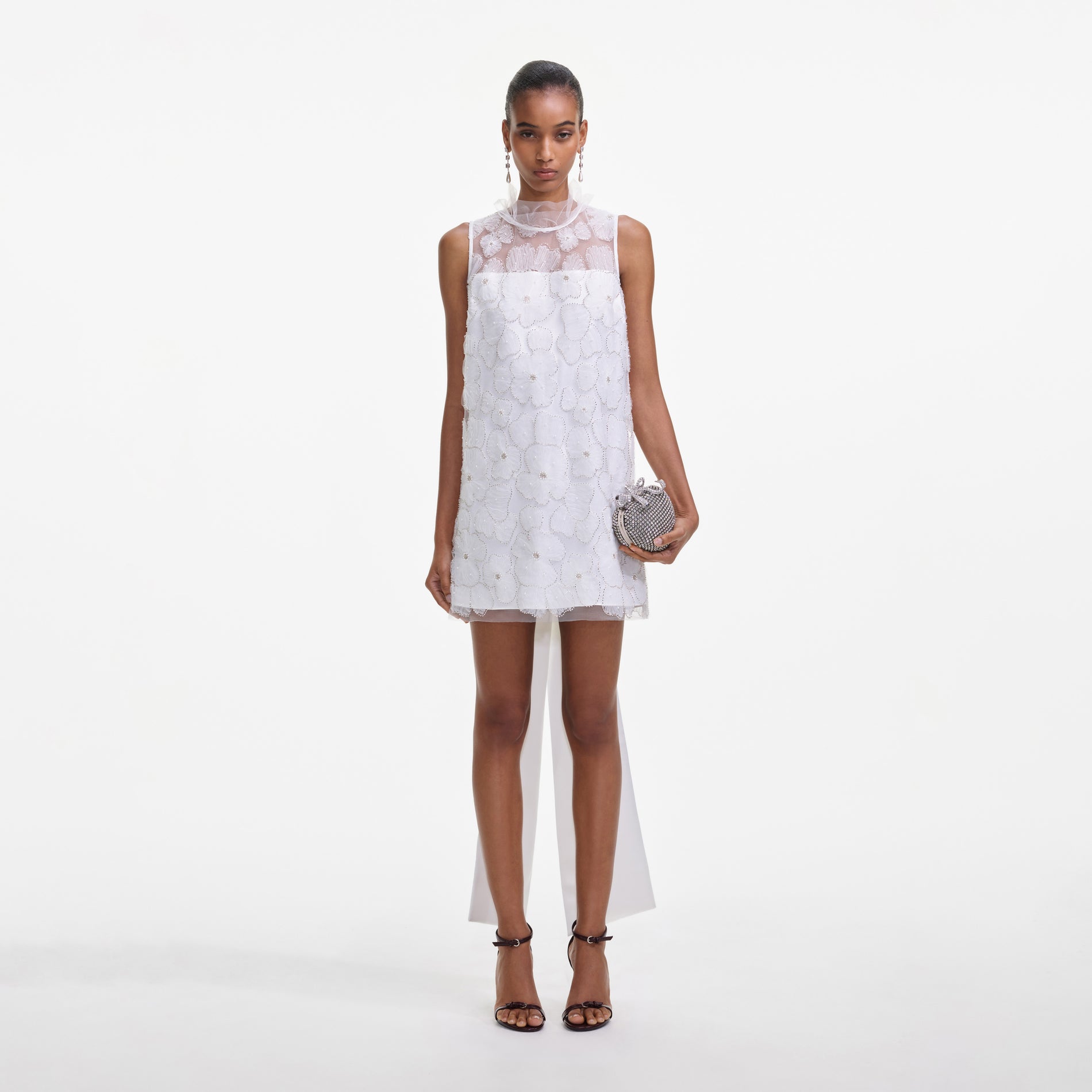 Front view of a woman wearing the White Tulle Satin Bow Mini Dress