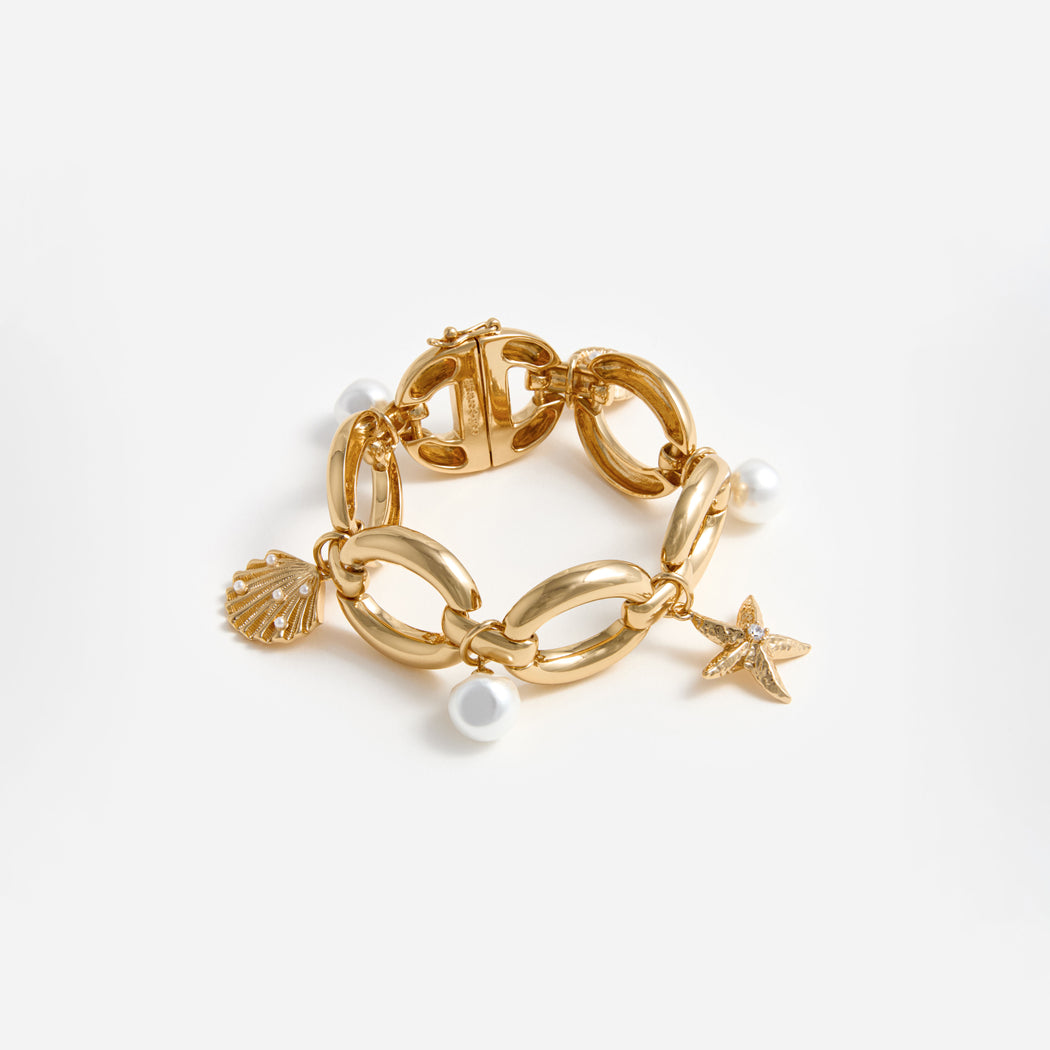A photo of the Gold Pearl Shell Charm Bracelet