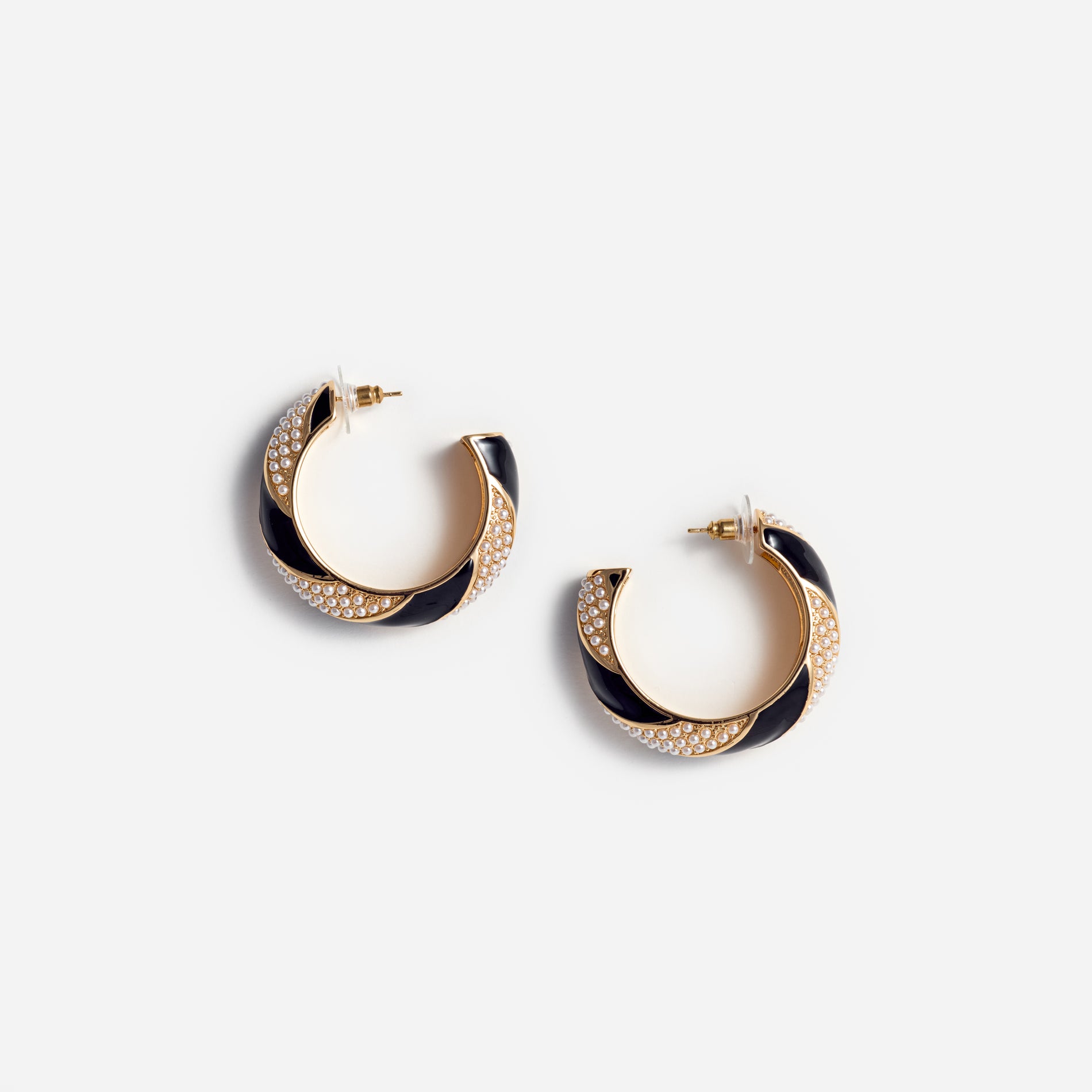 A photo of the Black And Gold Pearl Hoop Earrings
