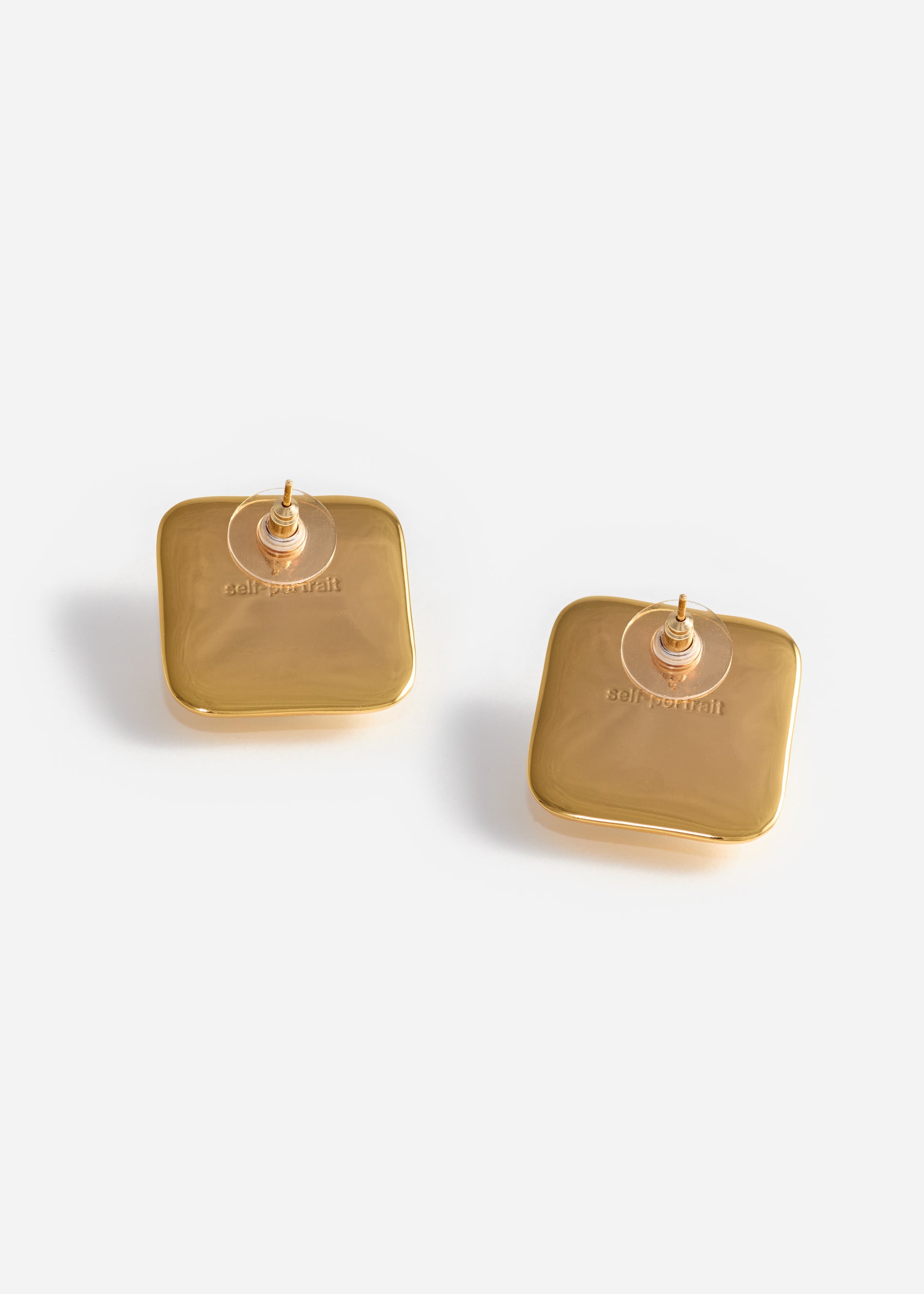 A photo of the Bow Pearl Gold Square Earrings