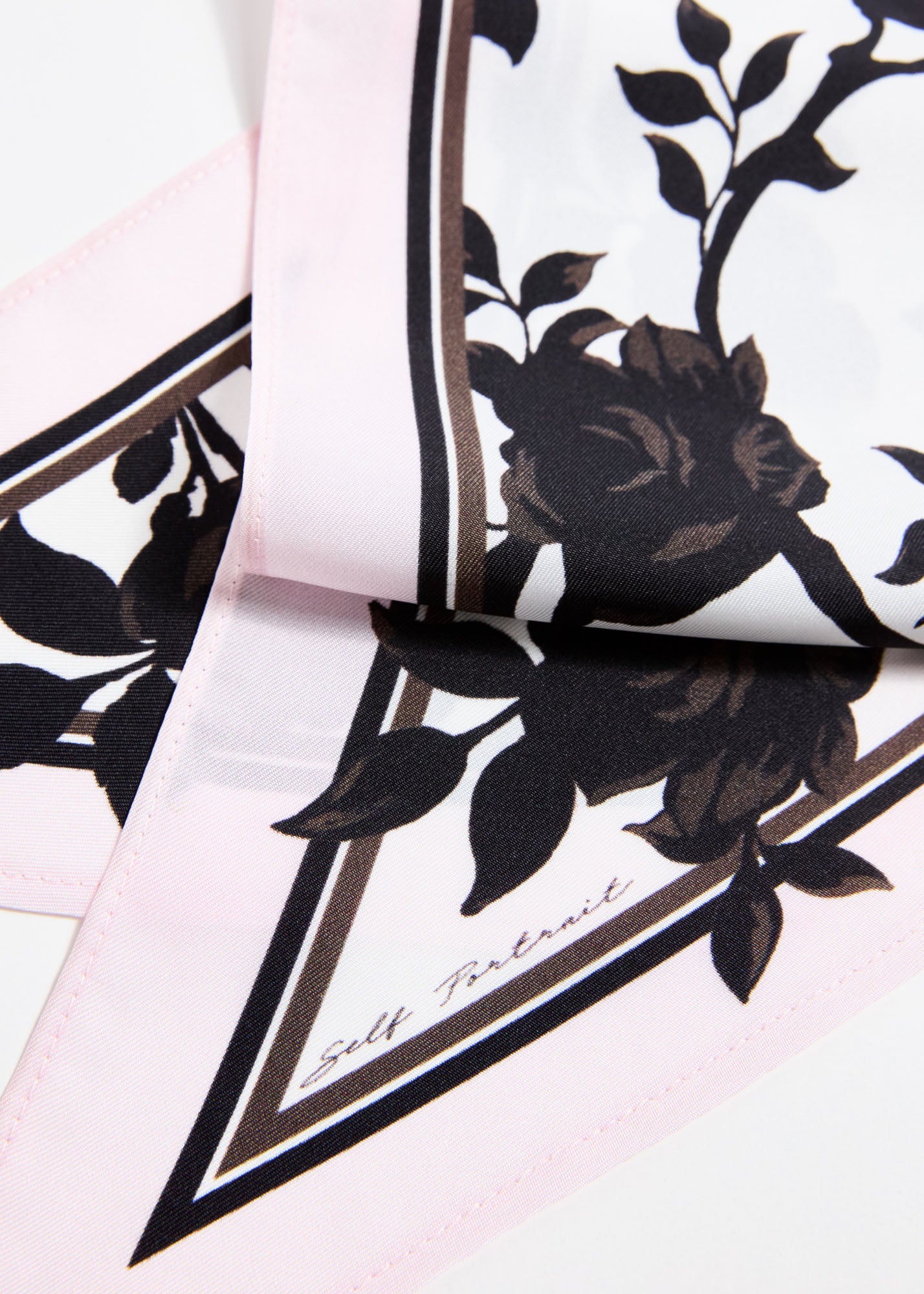 Back view of a woman wearing the Floral Print Twill Scarf