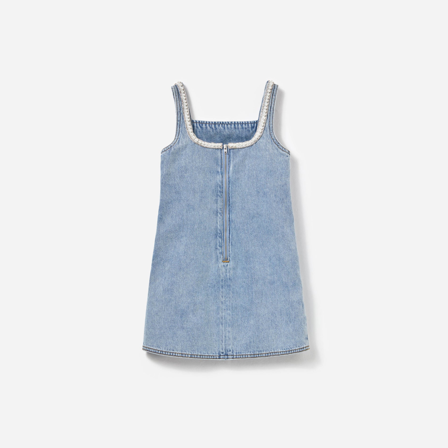 Side view of a woman wearing the Light Blue Denim Dress