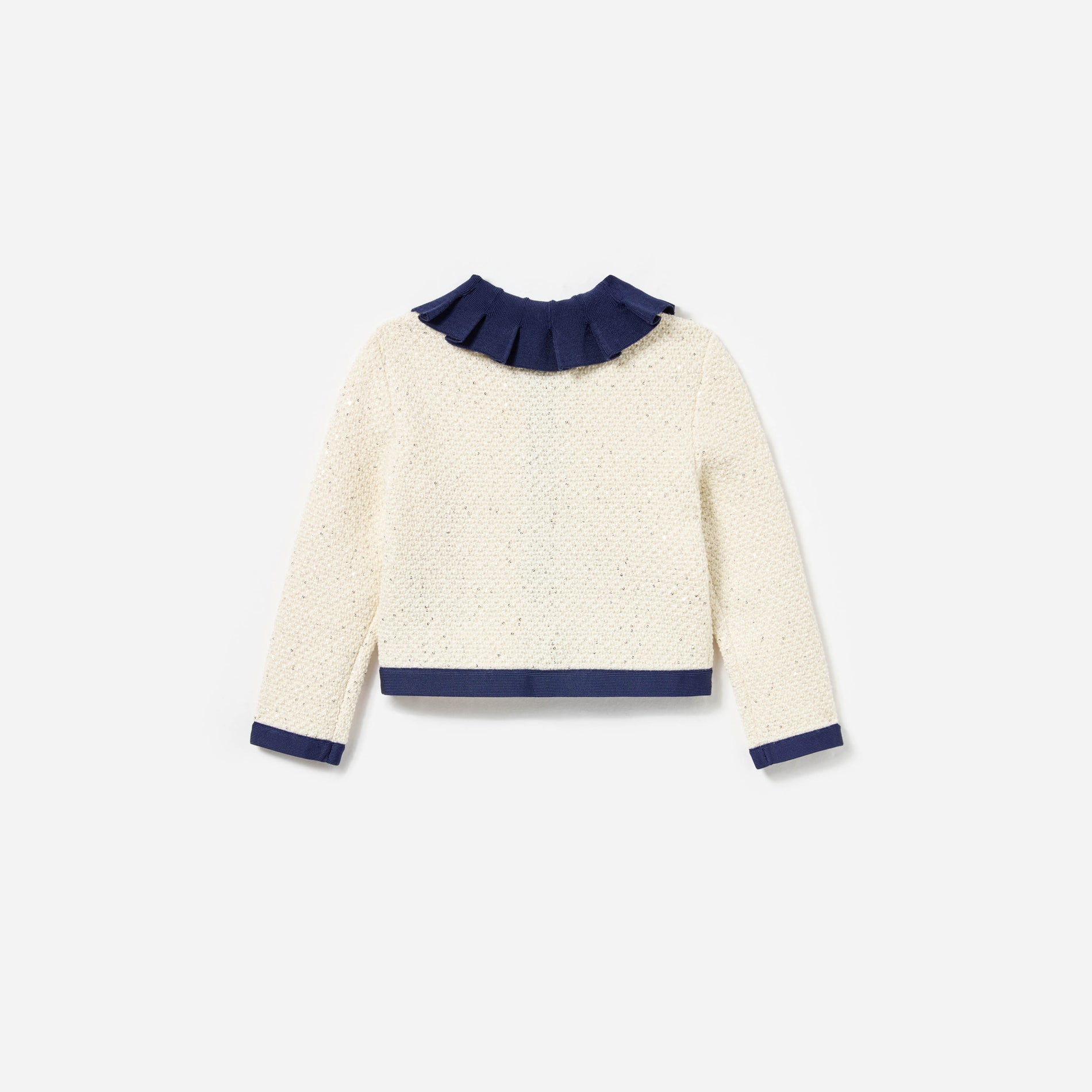 Side view of a woman wearing the Cream Sequin Knit Cardigan