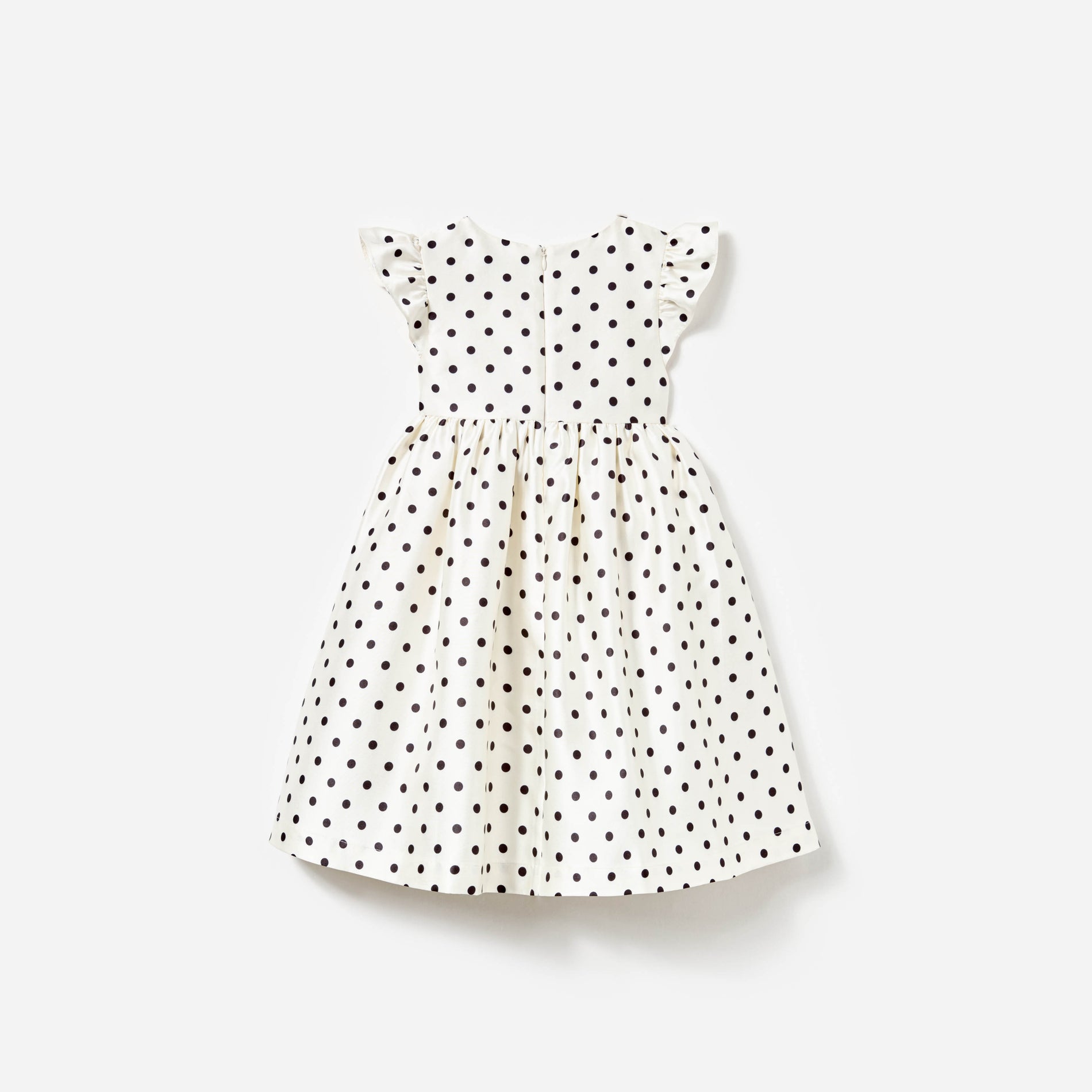 Side view of a woman wearing the Cream Polka Dot Taffeta Dress