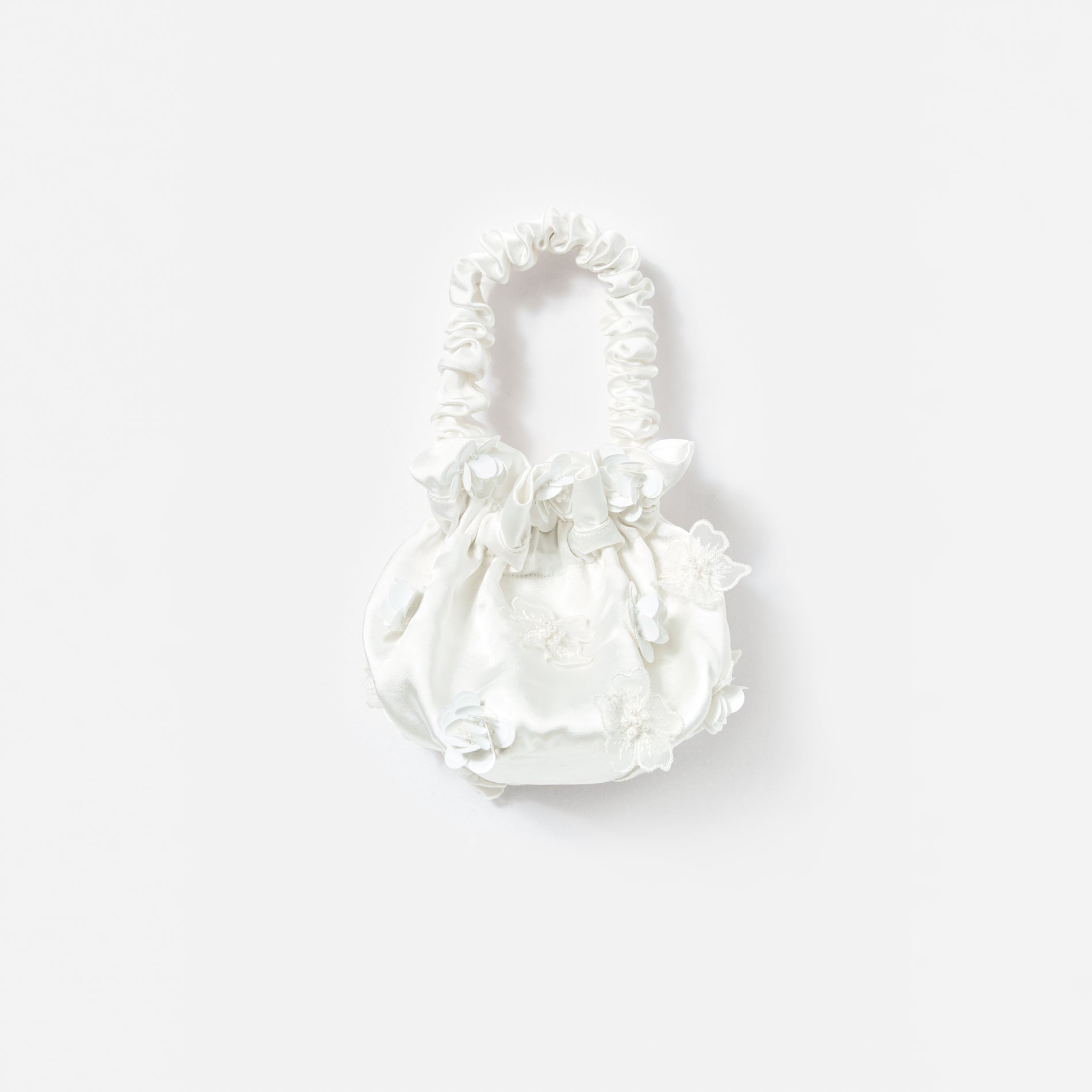 A photo of the Cream Satin Flower Bag