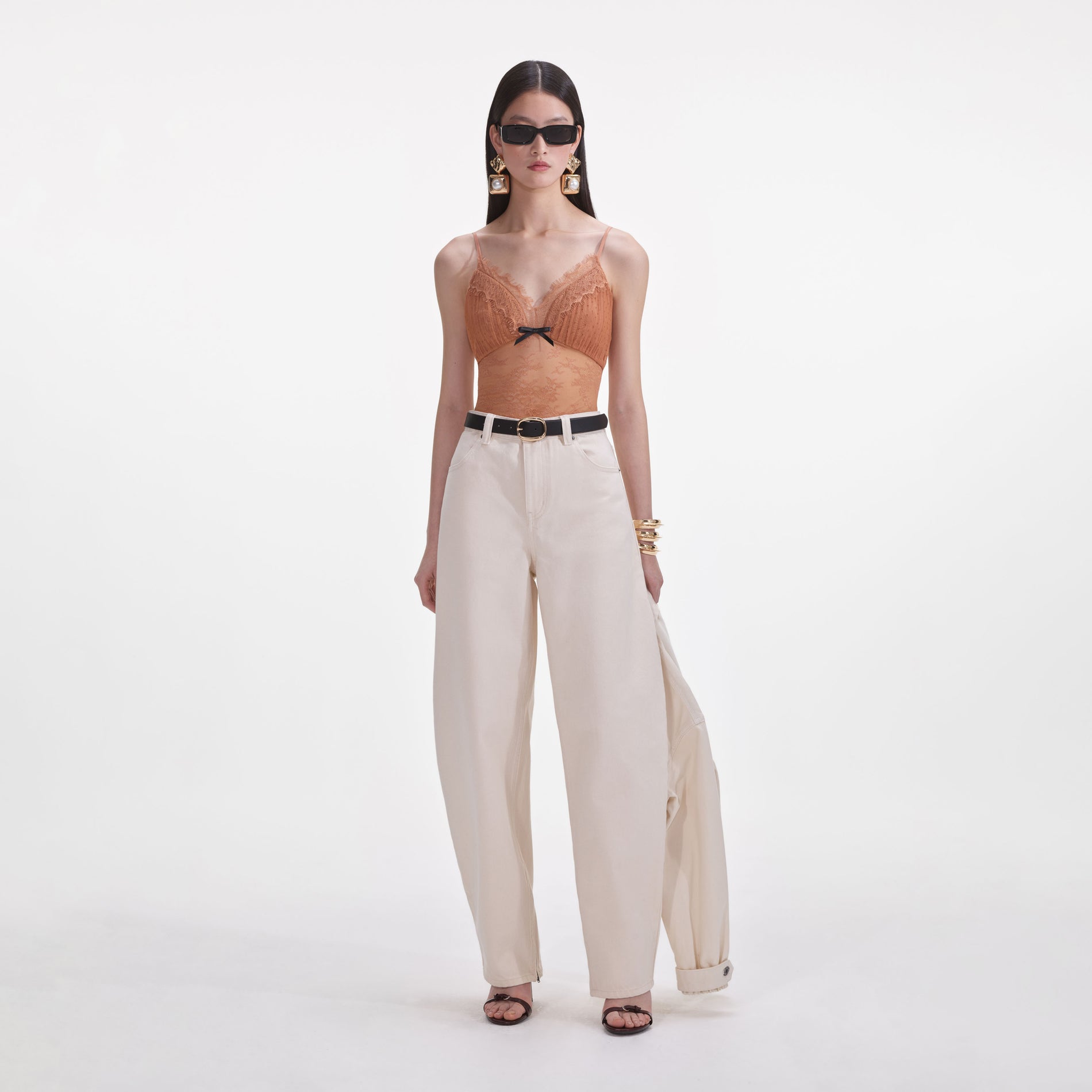 Front view of a woman wearing the Cream Denim Jeans