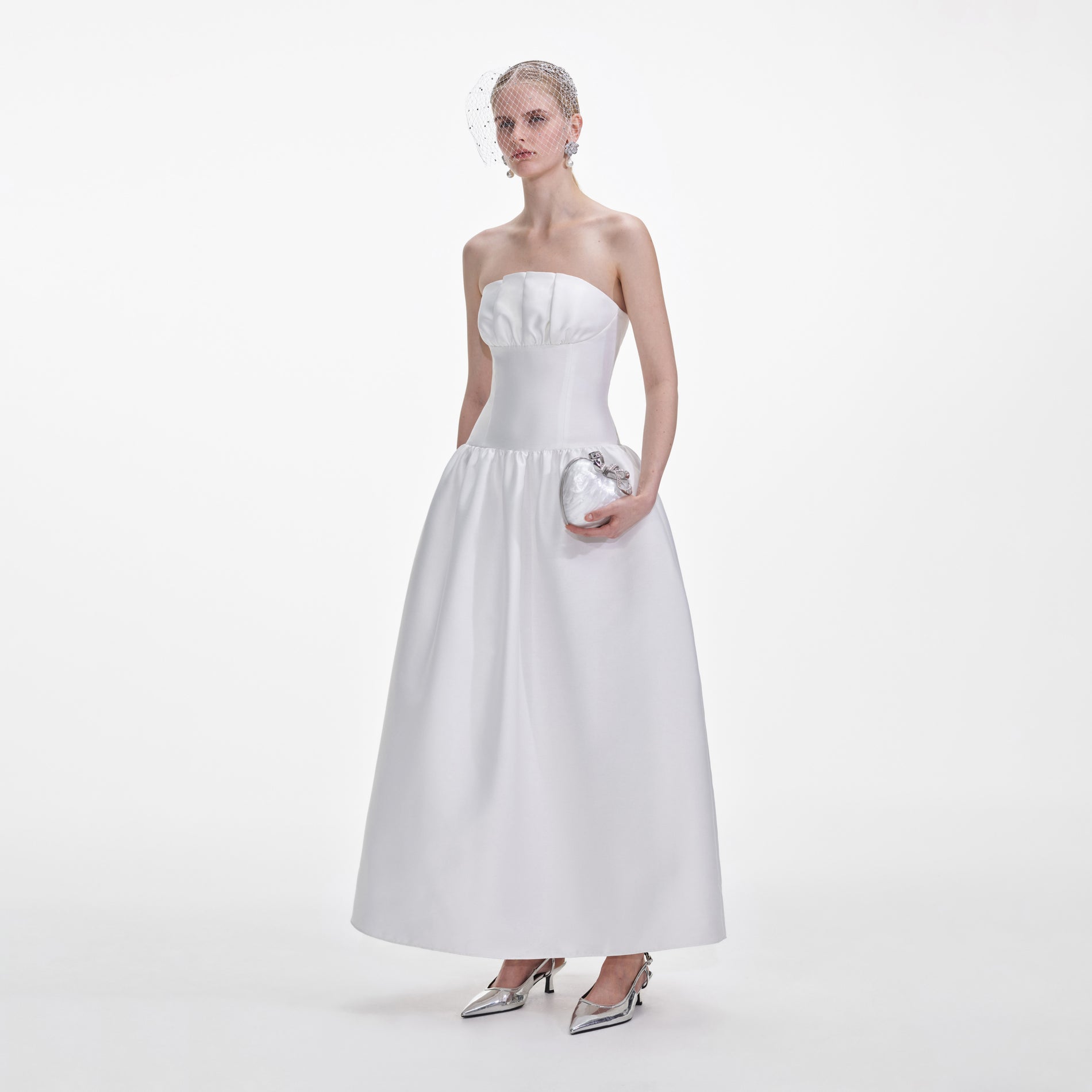 Side view of a woman wearing the White Taffeta Maxi Dress