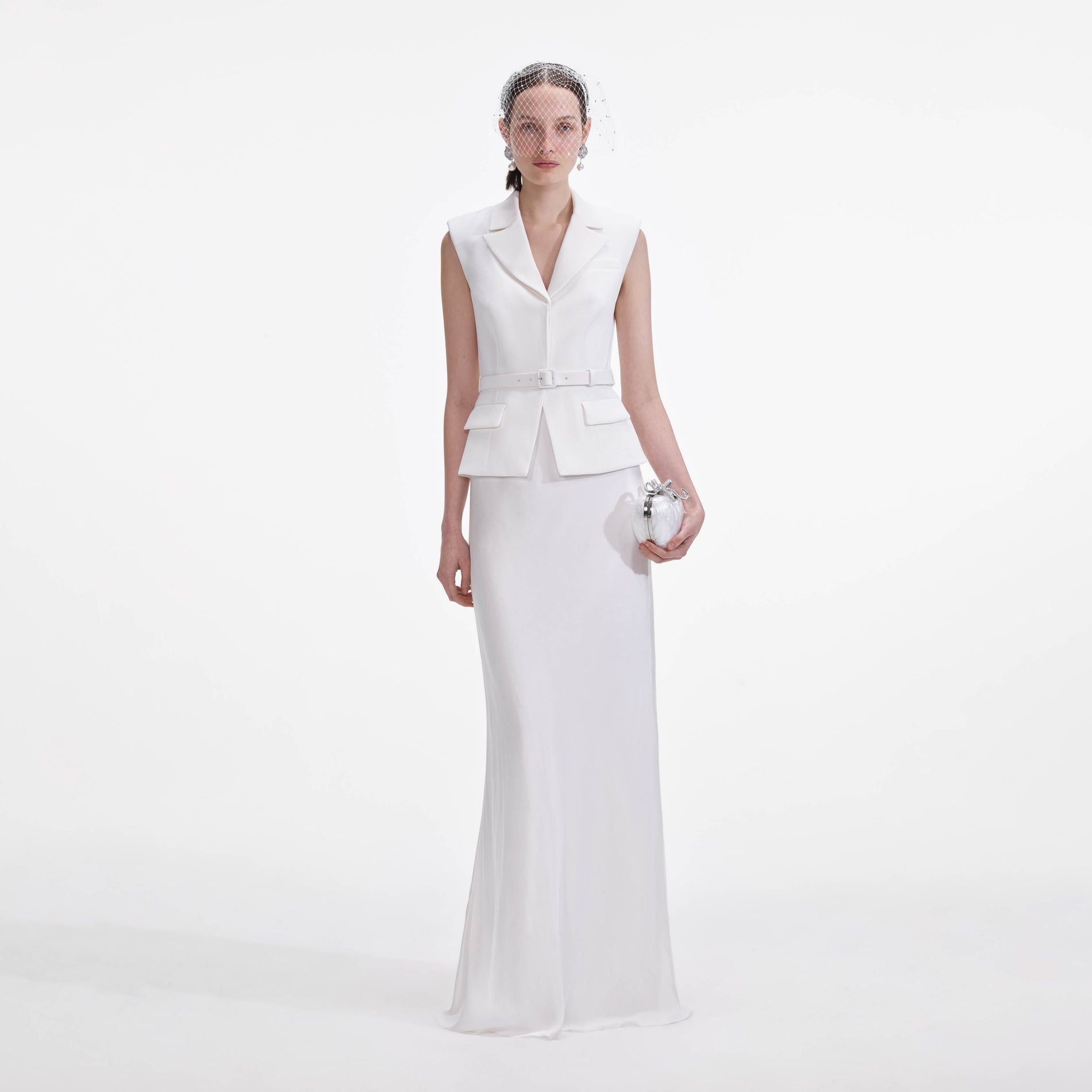 Front view of a woman wearing the White Crepe Maxi Dress