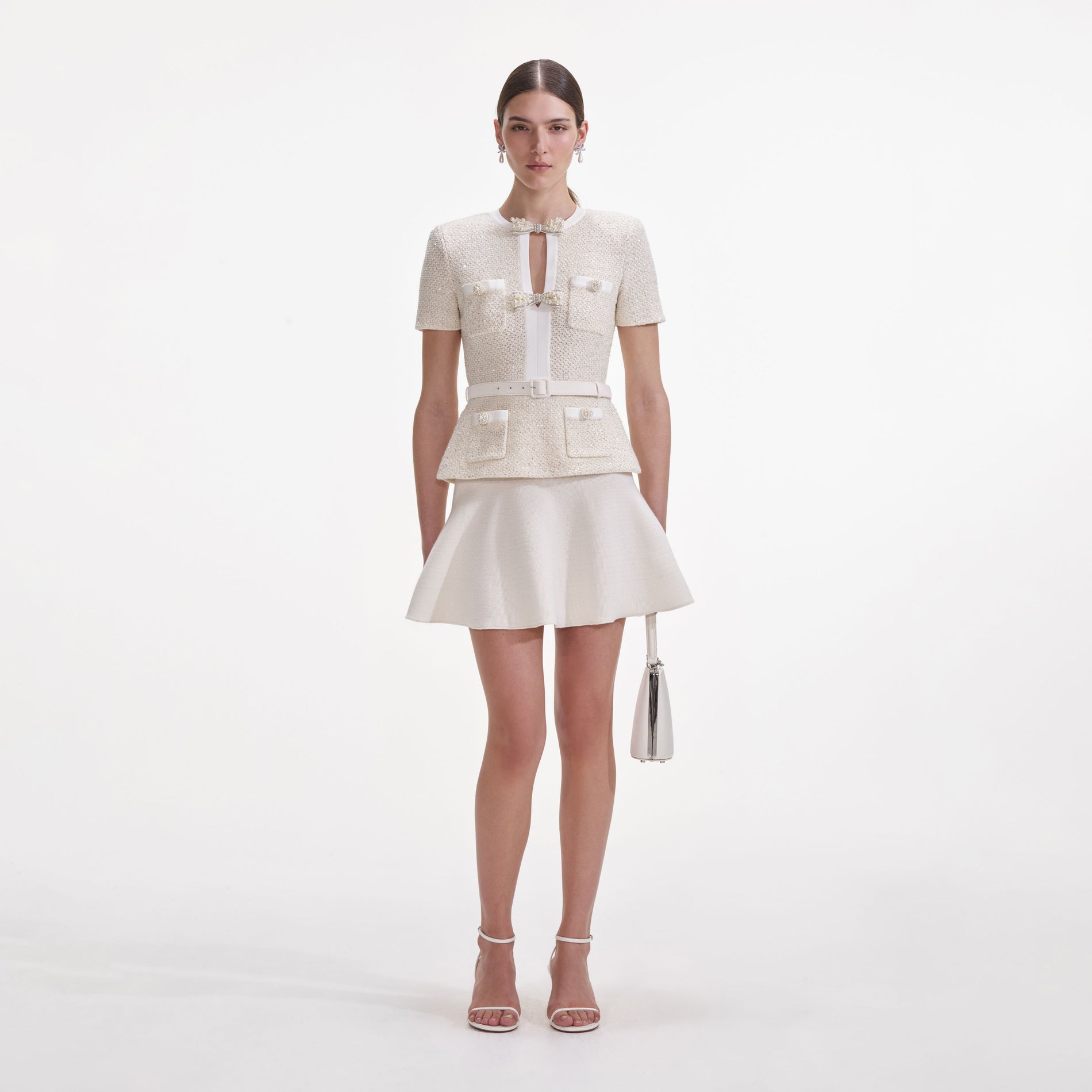 Front view of a woman wearing the Cream Sequin Knit Mini Dress