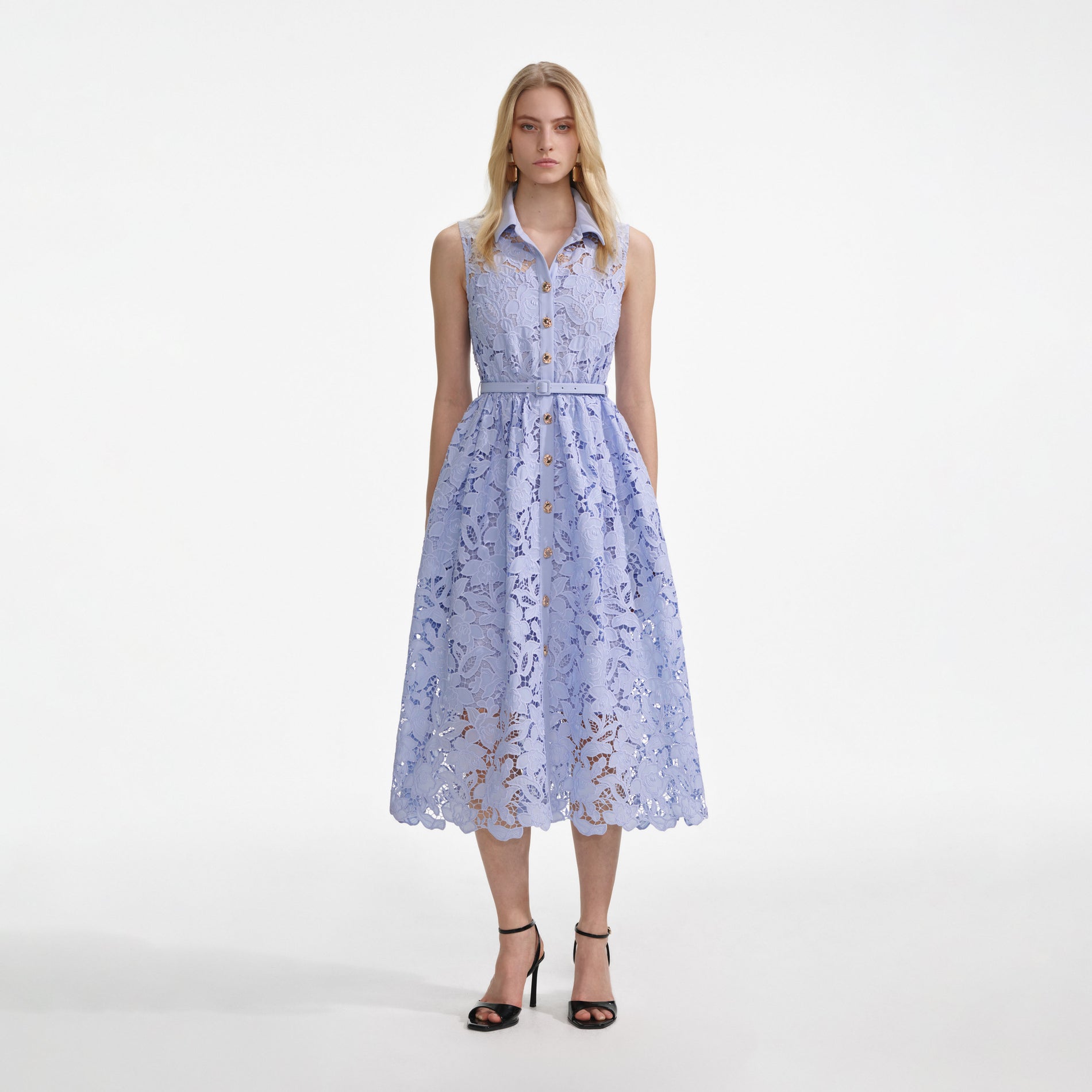 Front view of a woman wearing the Blue Lace Sleeveless Midi Dress