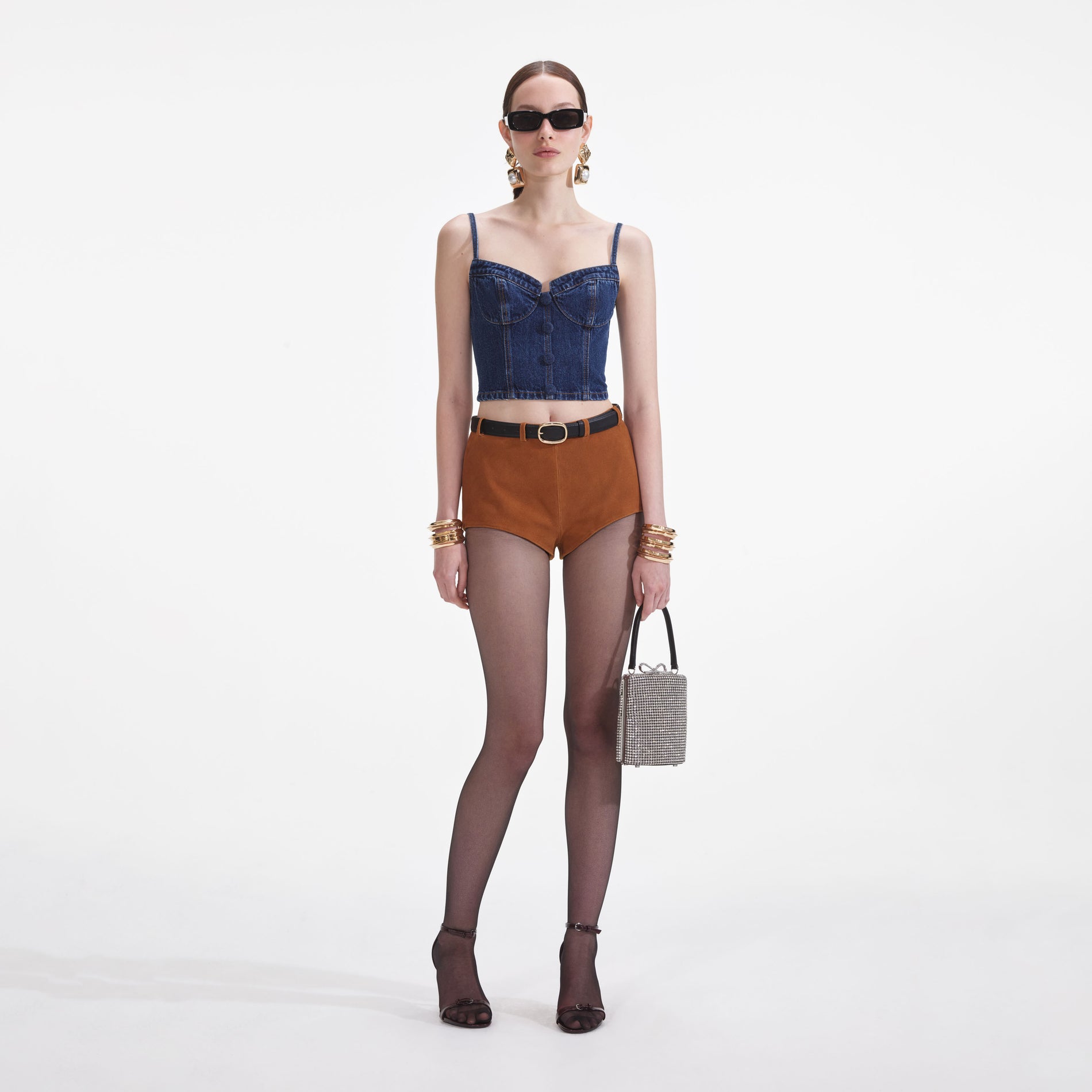 Front view of a woman wearing the Denim Strappy Top