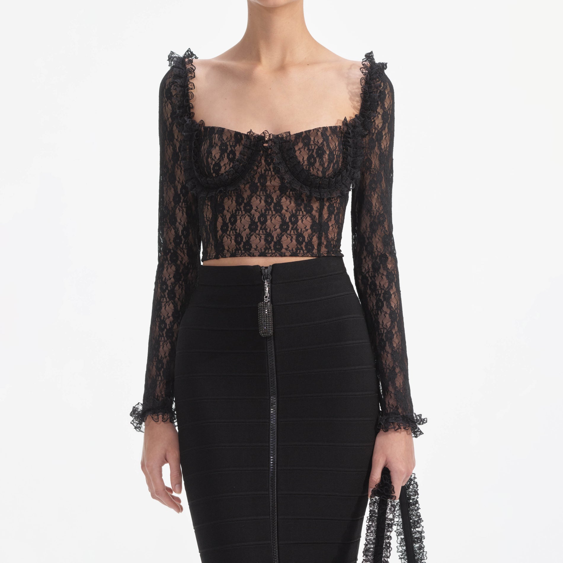 A close up of a woman wearing the Black Lace Ruffle Top