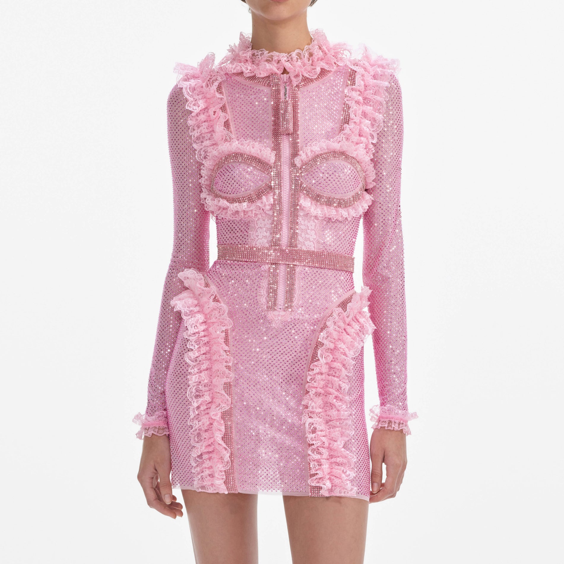 A close up of a woman wearing the Pink Rhinestone Mesh Ruffle Mini Dress