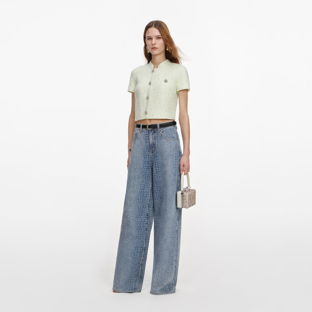 Side view of a woman wearing the Lime Boucle Top