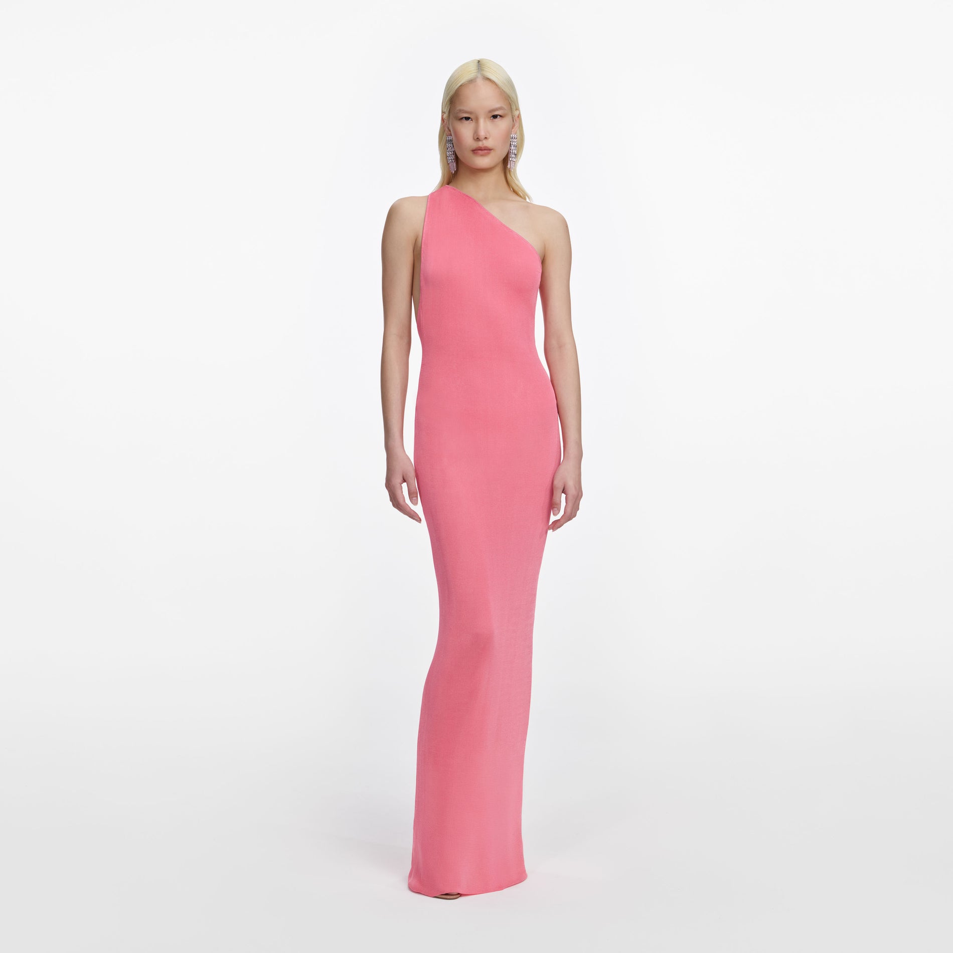 Front view of a woman wearing the Pink Viscose Knit One Shoulder Maxi Dress