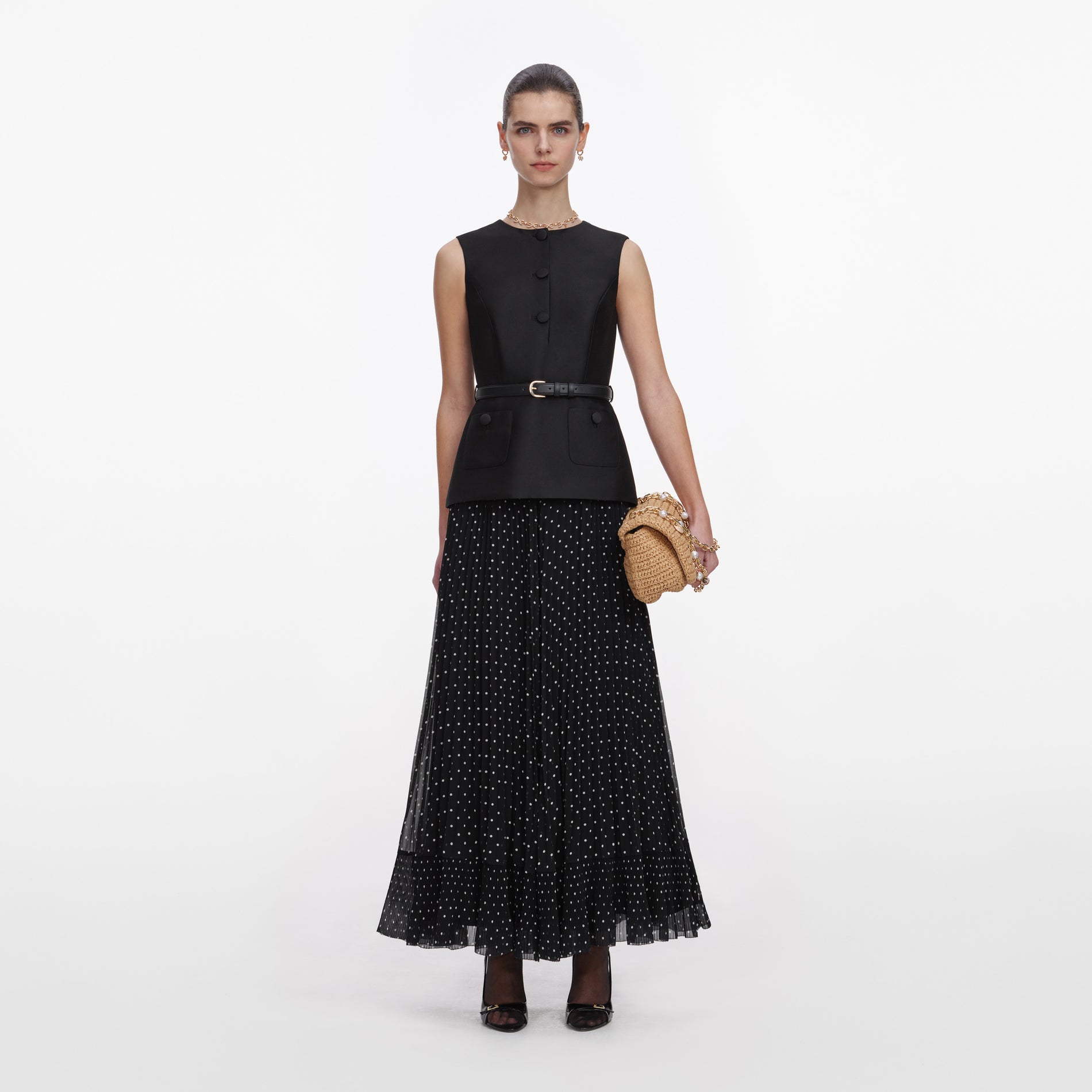 Front view of a woman wearing the Black Taffeta Polka Dot Midi Dress