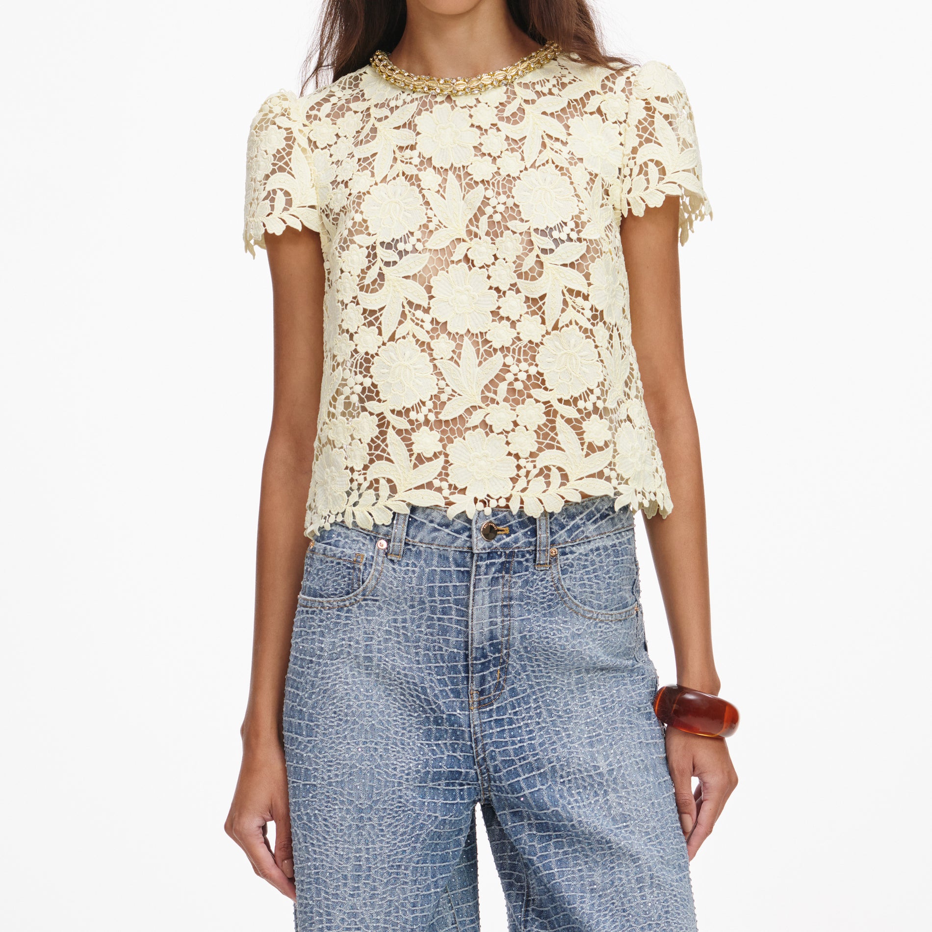 A close up of a woman wearing the Yellow Lace Top