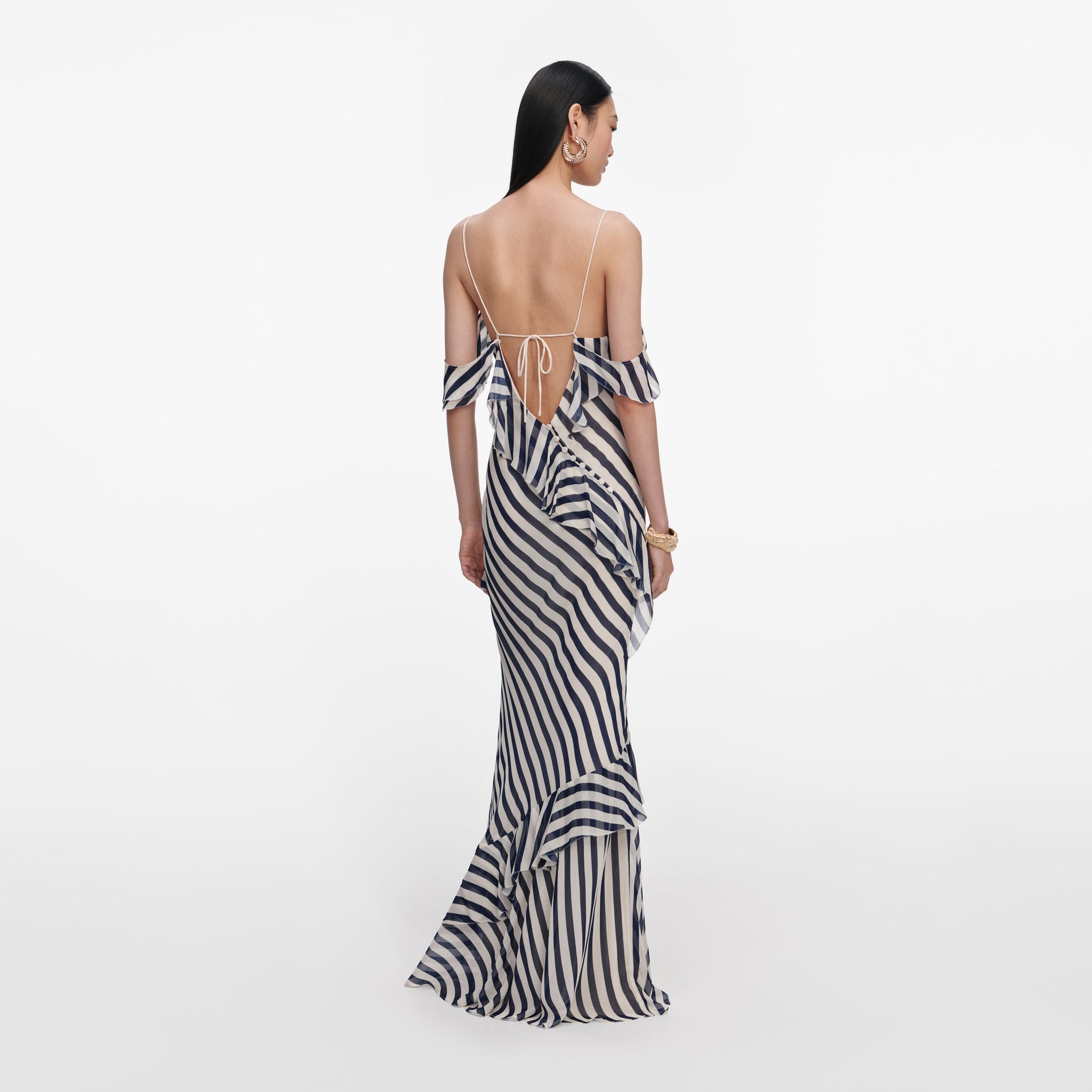 Back view of a woman wearing the Navy Stripe Georgette Maxi Dress
