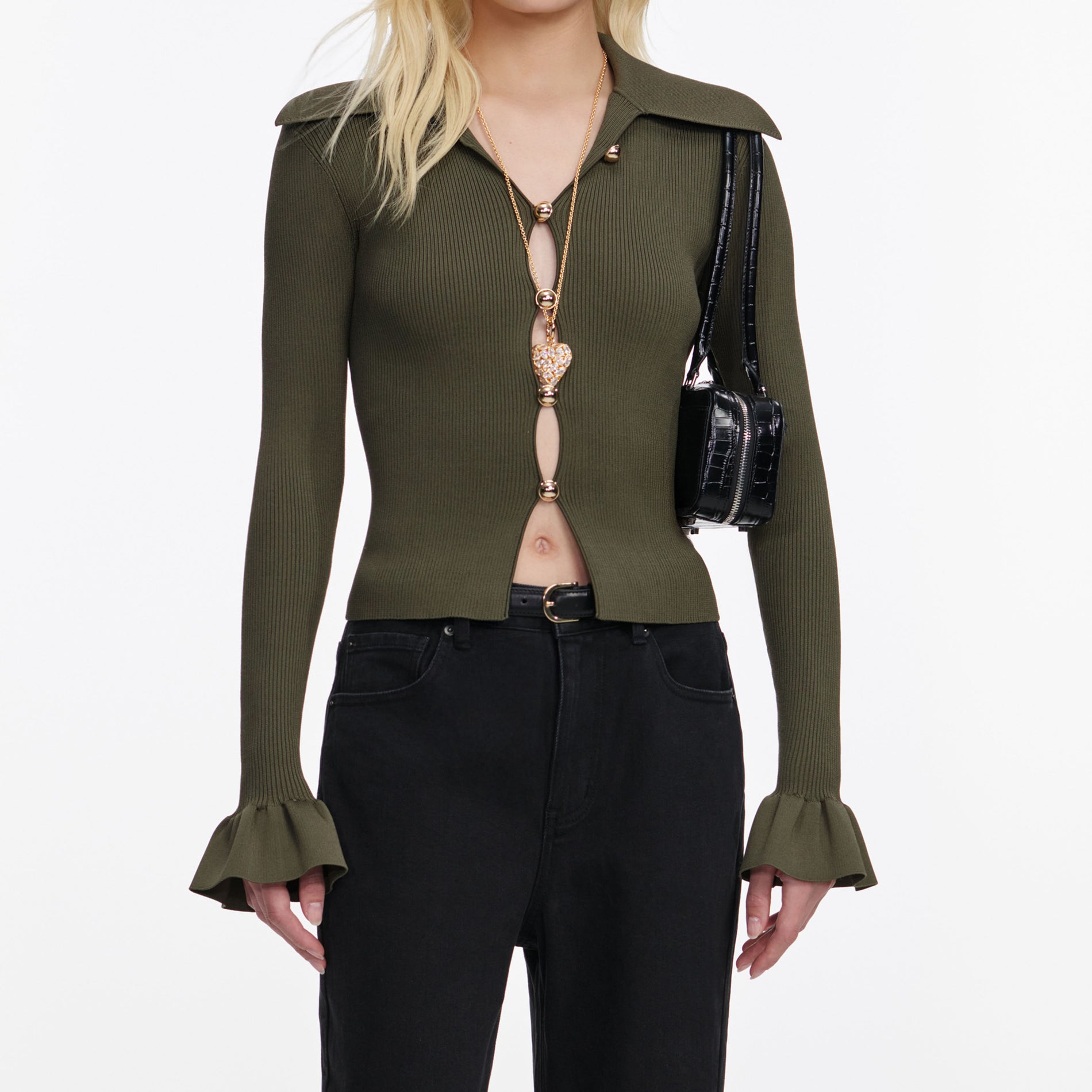 A close up of a woman wearing the Khaki Button Down Knit Top