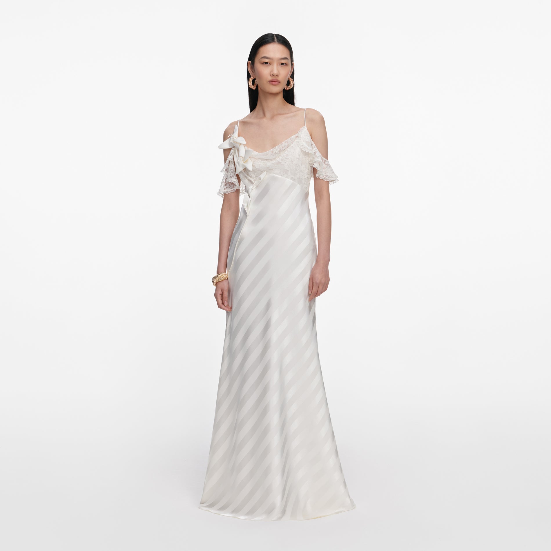 Front view of a woman wearing the Cream Satin Striped Maxi Dress