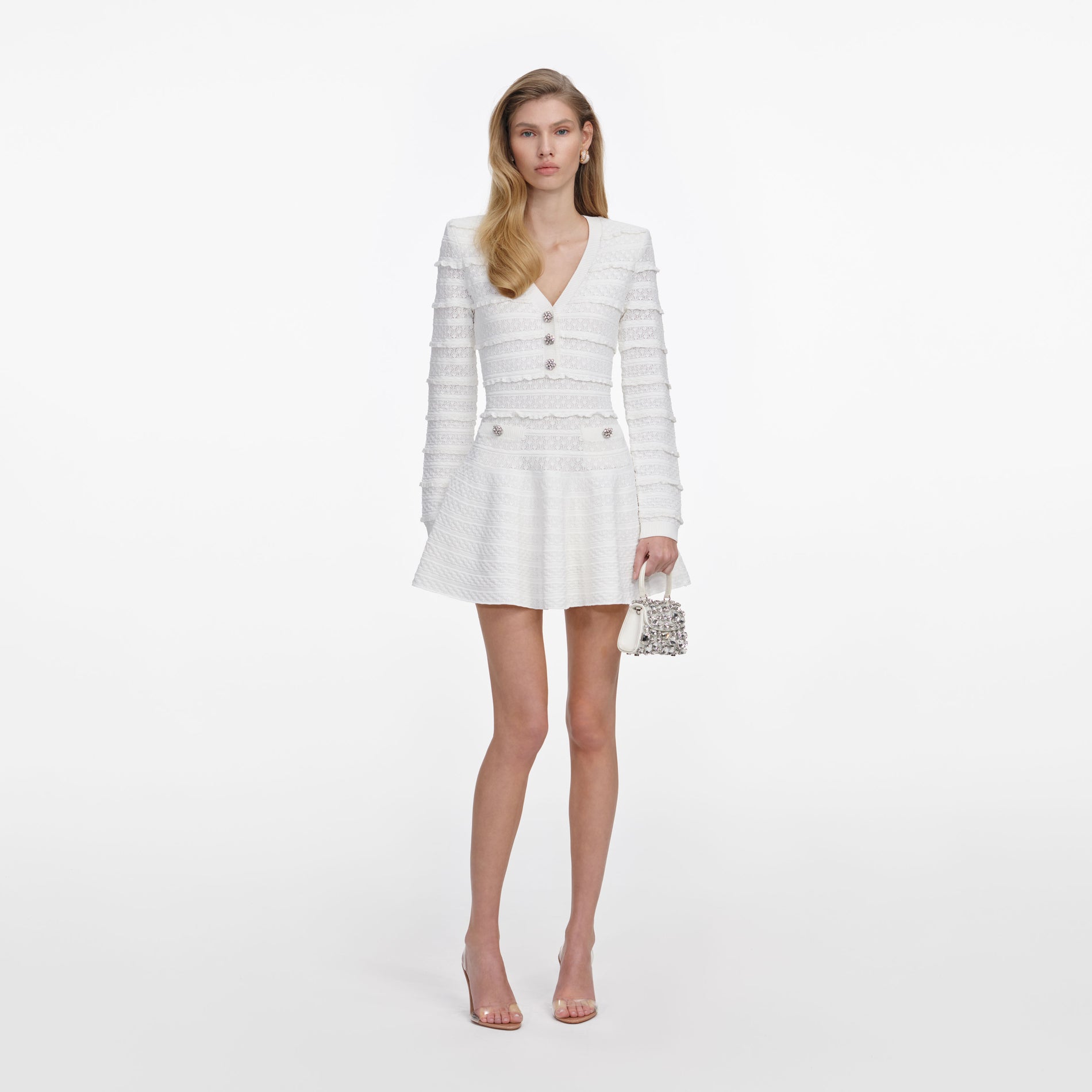 Front view of a woman wearing the White Pointelle Diamante Knit Mini Dress