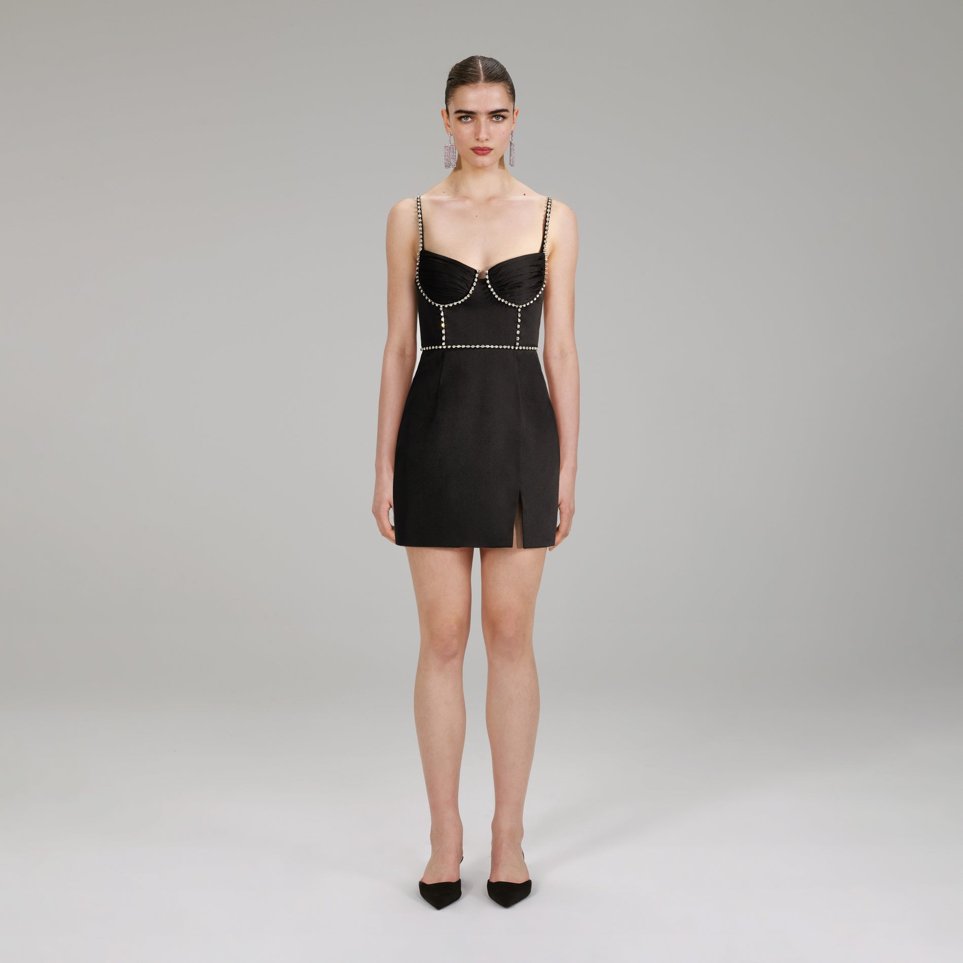 A woman wearing the Bonded Satin Mini Dress