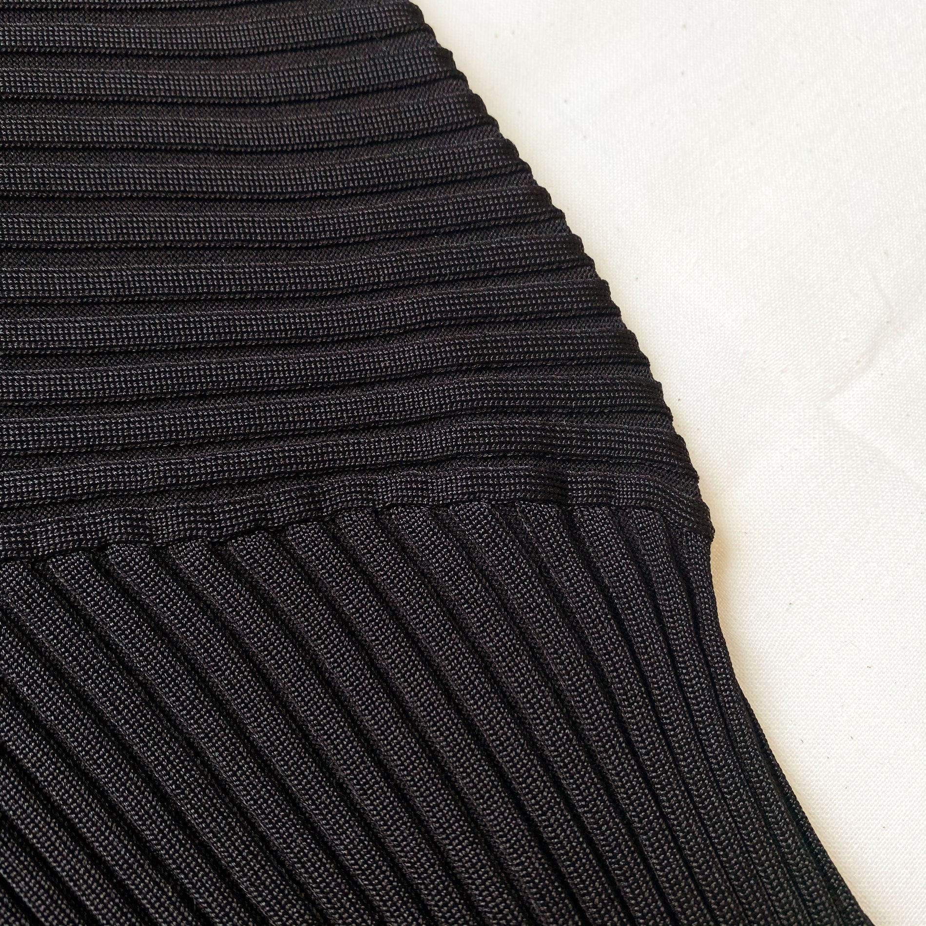 A close up of the fabric for the Black Ribbed Knit Cut Out Top