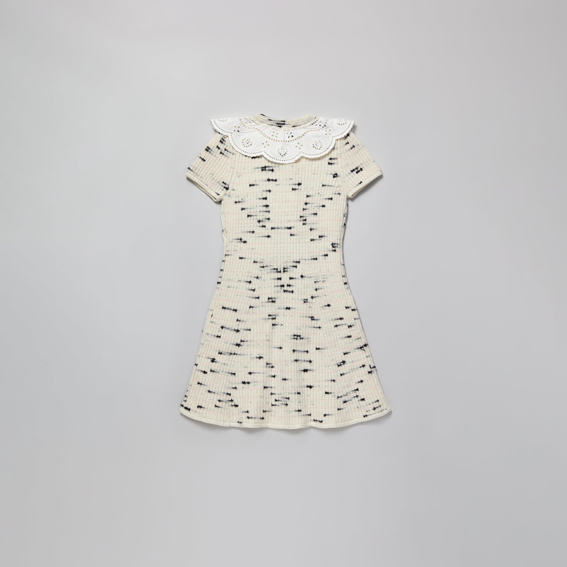 A woman wearing the Ivory Contrast Yarn Knit Dress