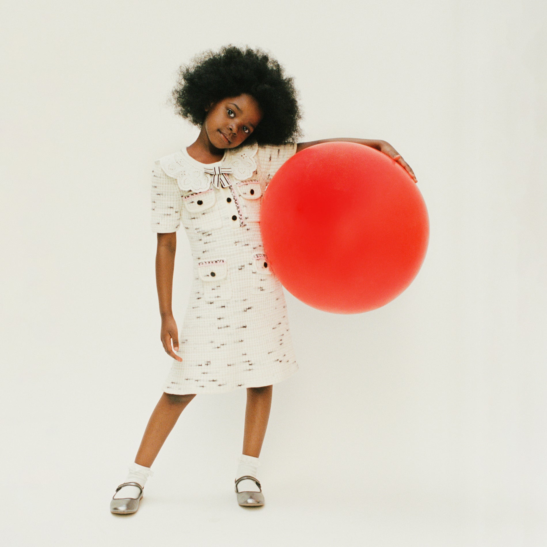 A woman wearing the Ivory Contrast Yarn Knit Dress