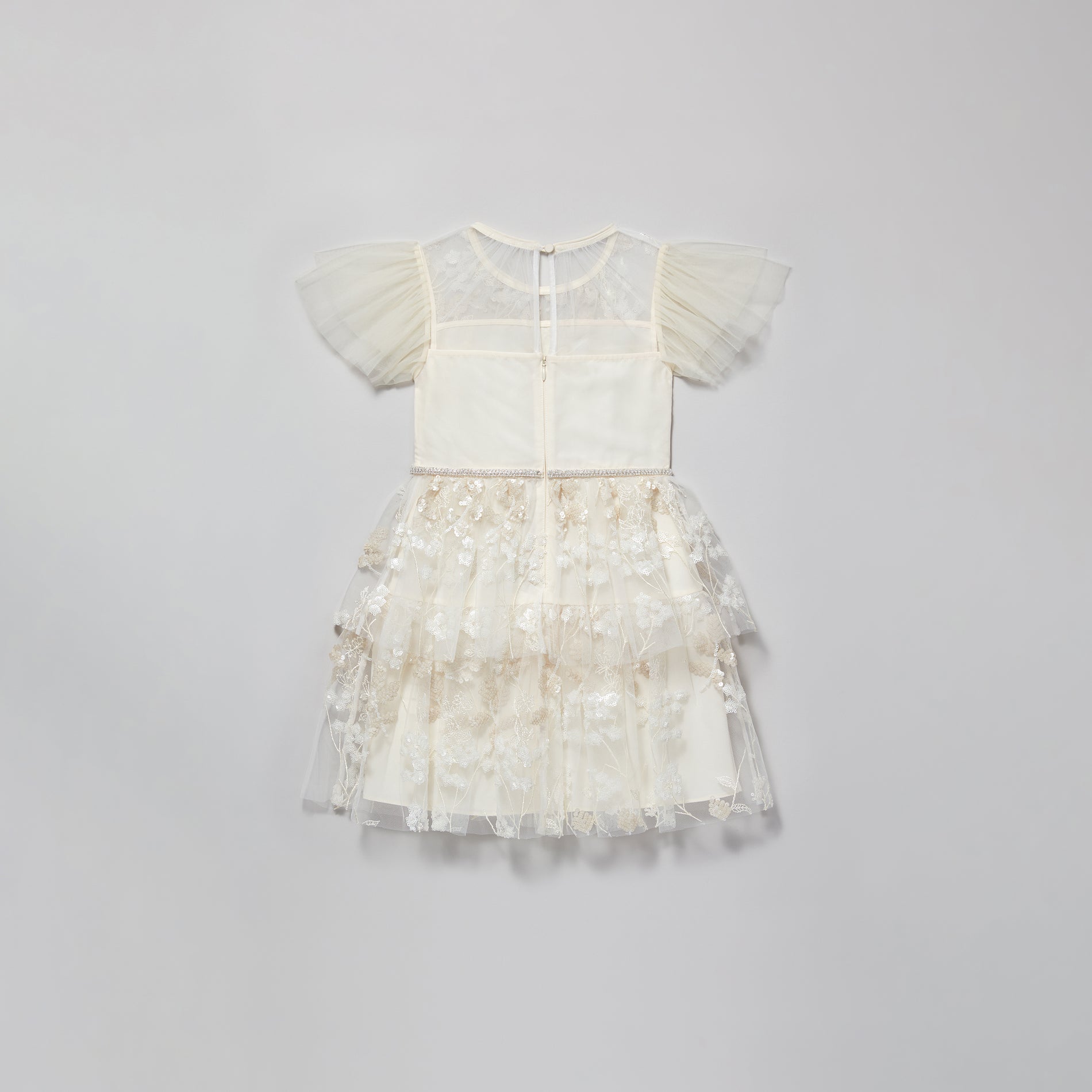 A woman wearing the Ivory Blossom Sequin Dress