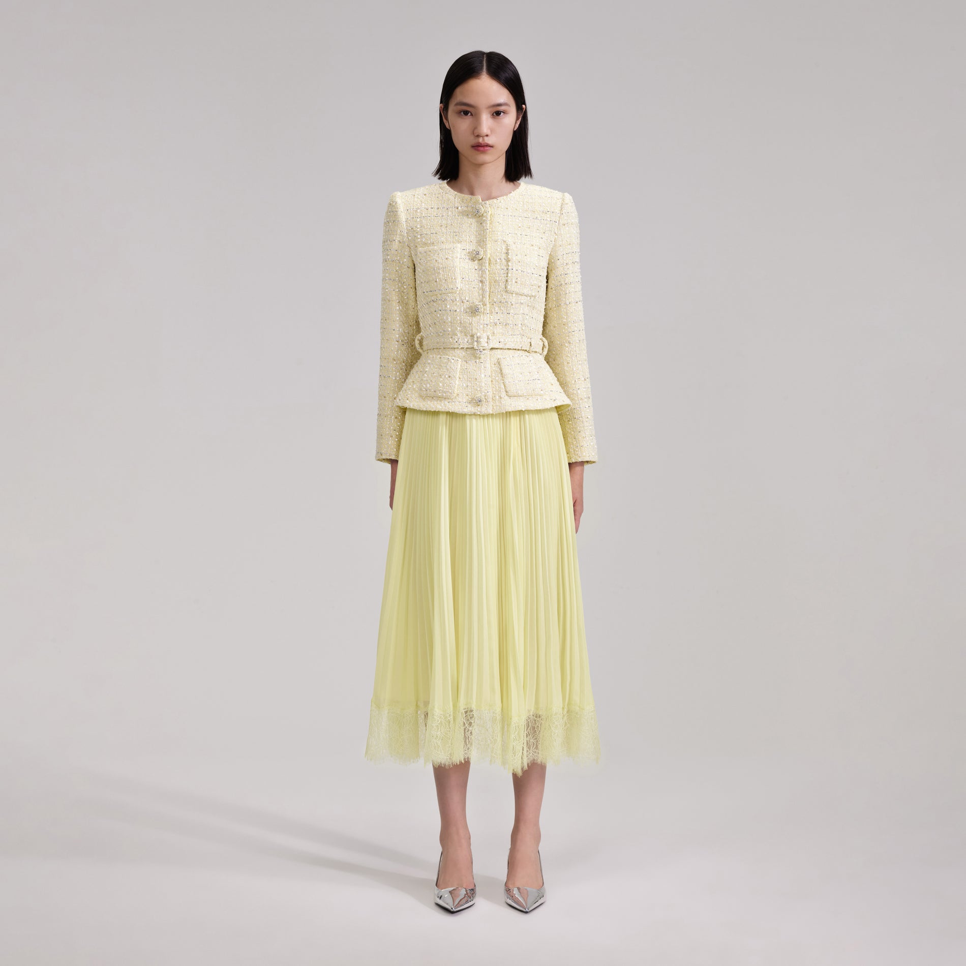 A woman wearing the Yellow Boucle Midi Dress