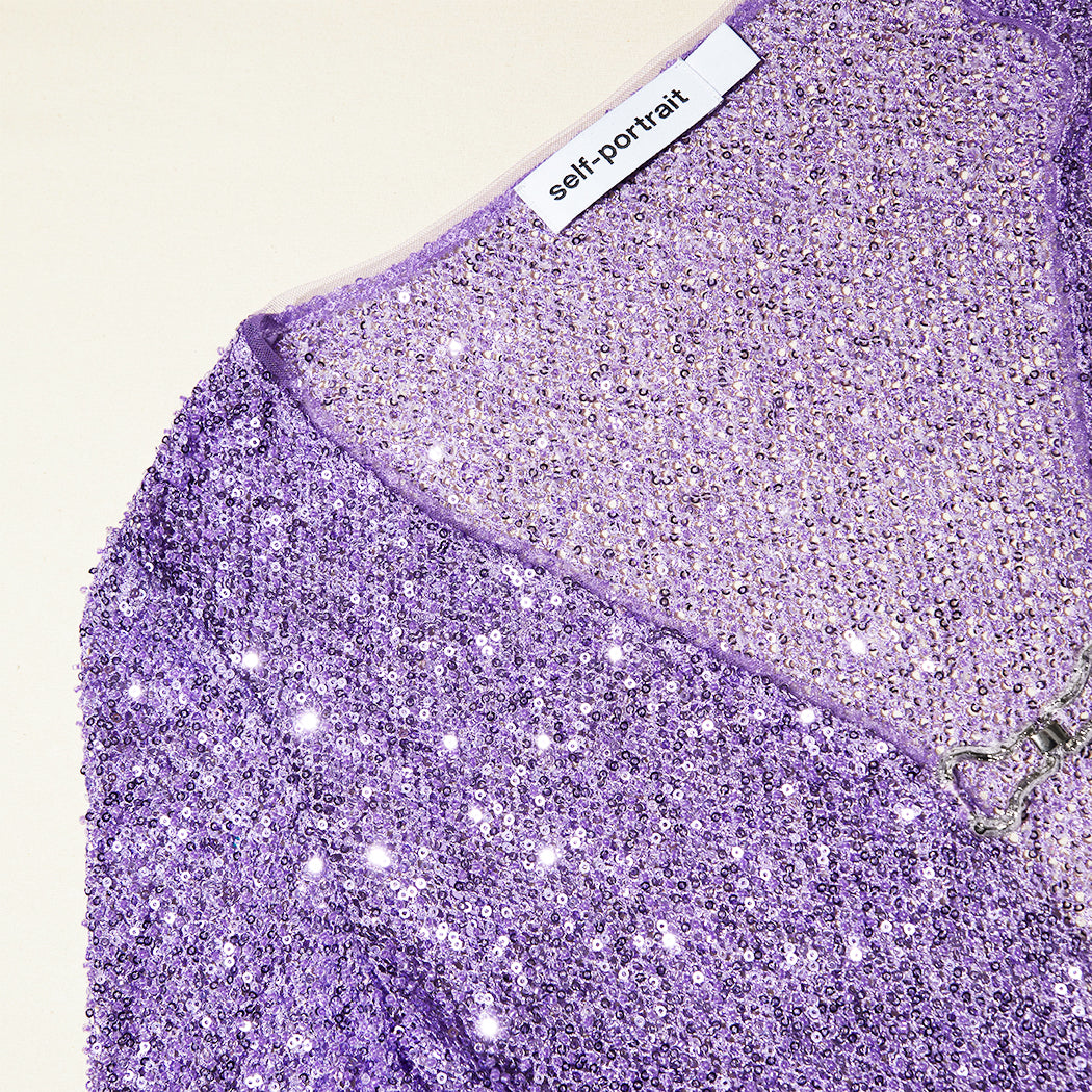 A close up of the fabric for the Purple Beaded Cardigan