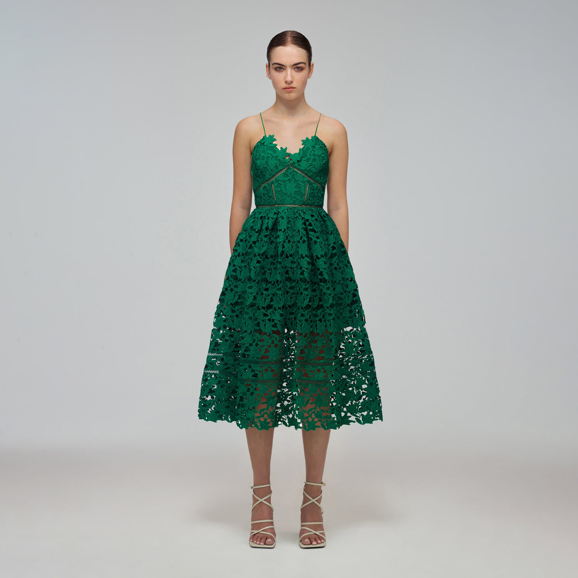 A woman wearing the Green Azaelea Midi Dress