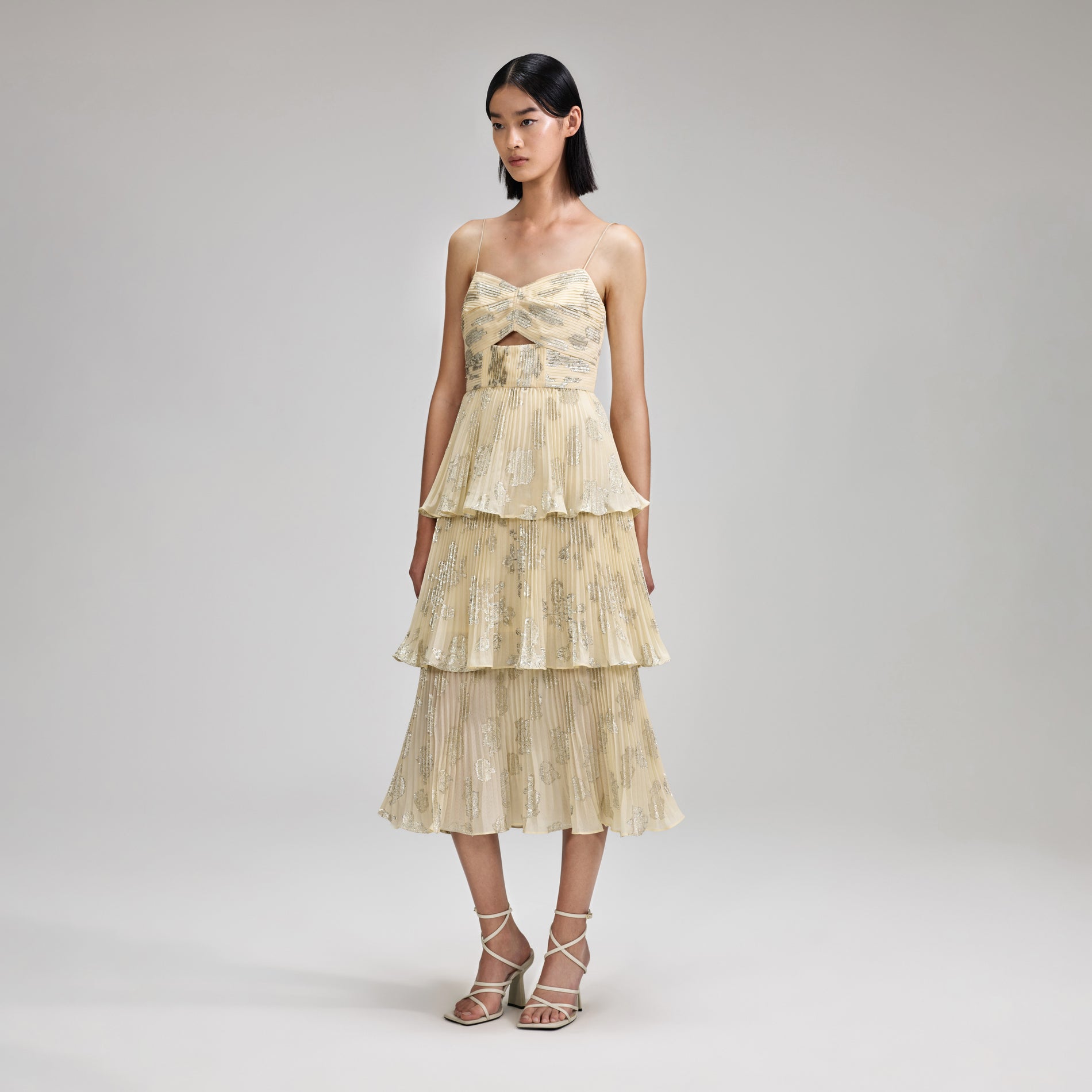 A woman wearing the Metallic Jacquard Midi Dress
