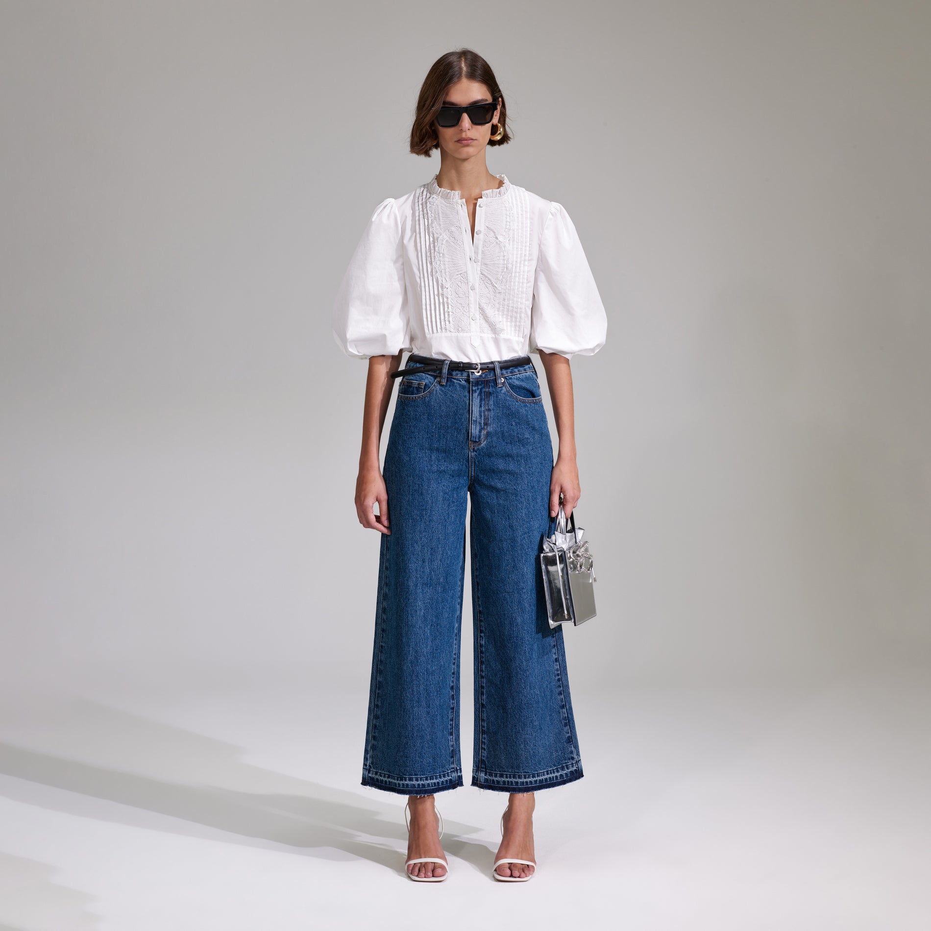 A woman wearing the White Cotton Poplin Top