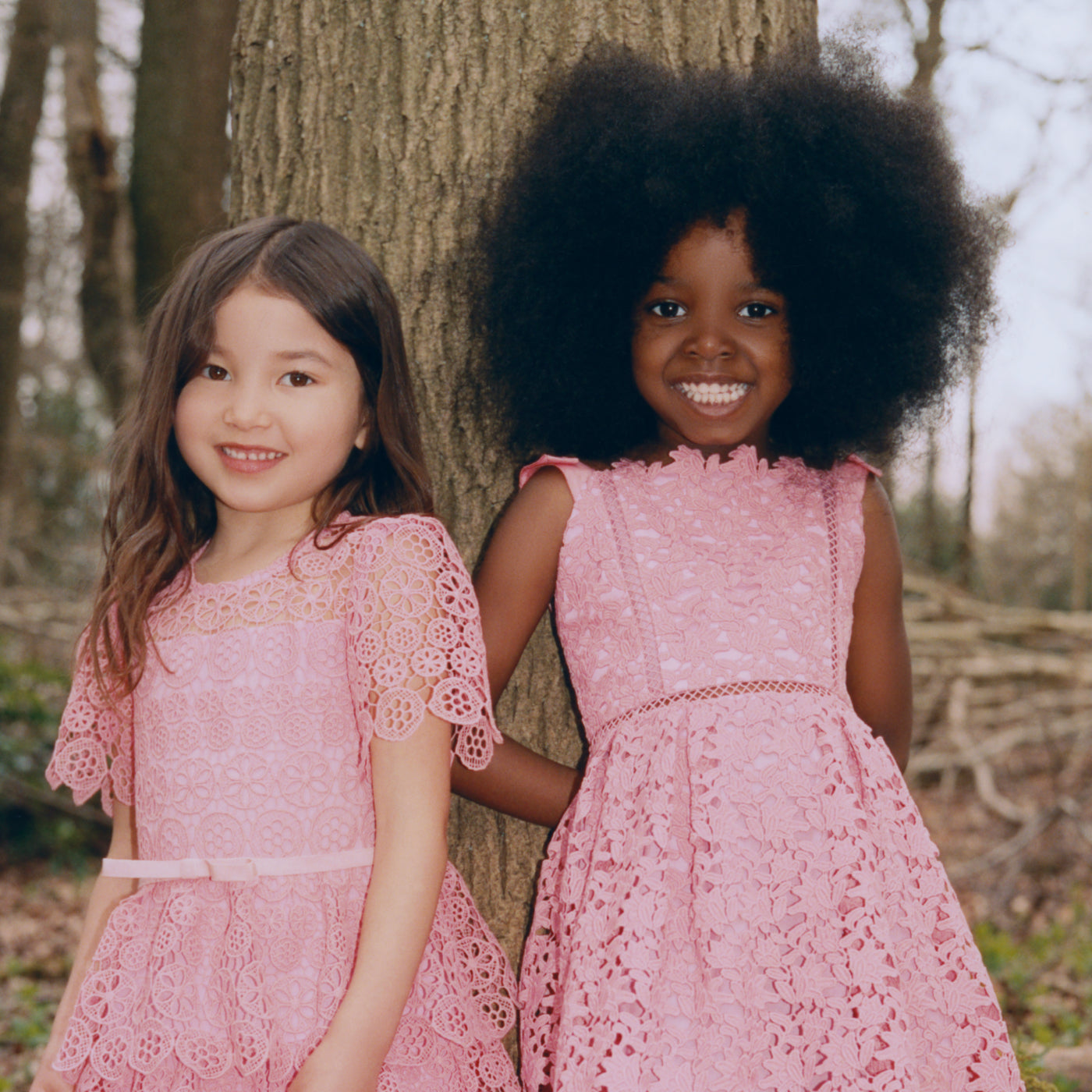 A woman wearing the Pink Azaelea Bow Detail Midi Dress